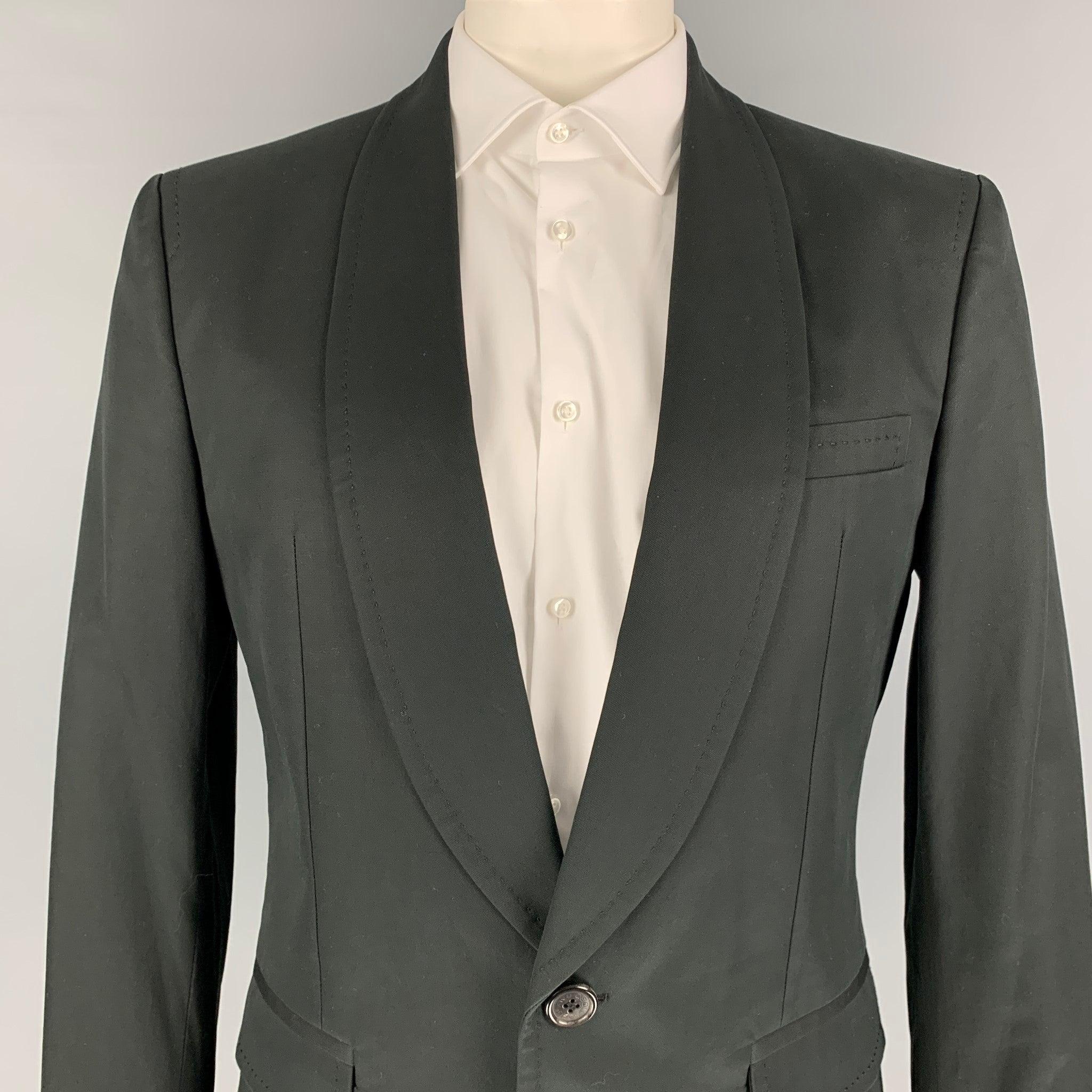 DSQUARED2 sport coat comes in a black cotton with a full liner featuring a shawl collar, flap pockets, single back vent, and a single button closure. Made in Italy.
Very Good
Pre-Owned Condition. 

Marked:   Size tag removed.  

Measurements: 
