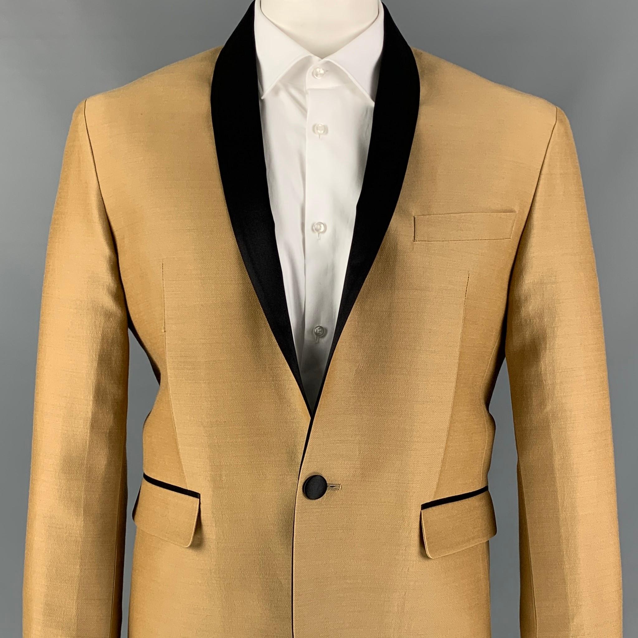 DSQUARED2 sport coat comes in a tan & black wool / silk with a half liner featuring a shawl collar, flap pockets, single back vent, and a single button closure. Made in Italy. 

Very Good Pre-Owned Condition.
Marked: 56

Measurements:

Shoulder: 19