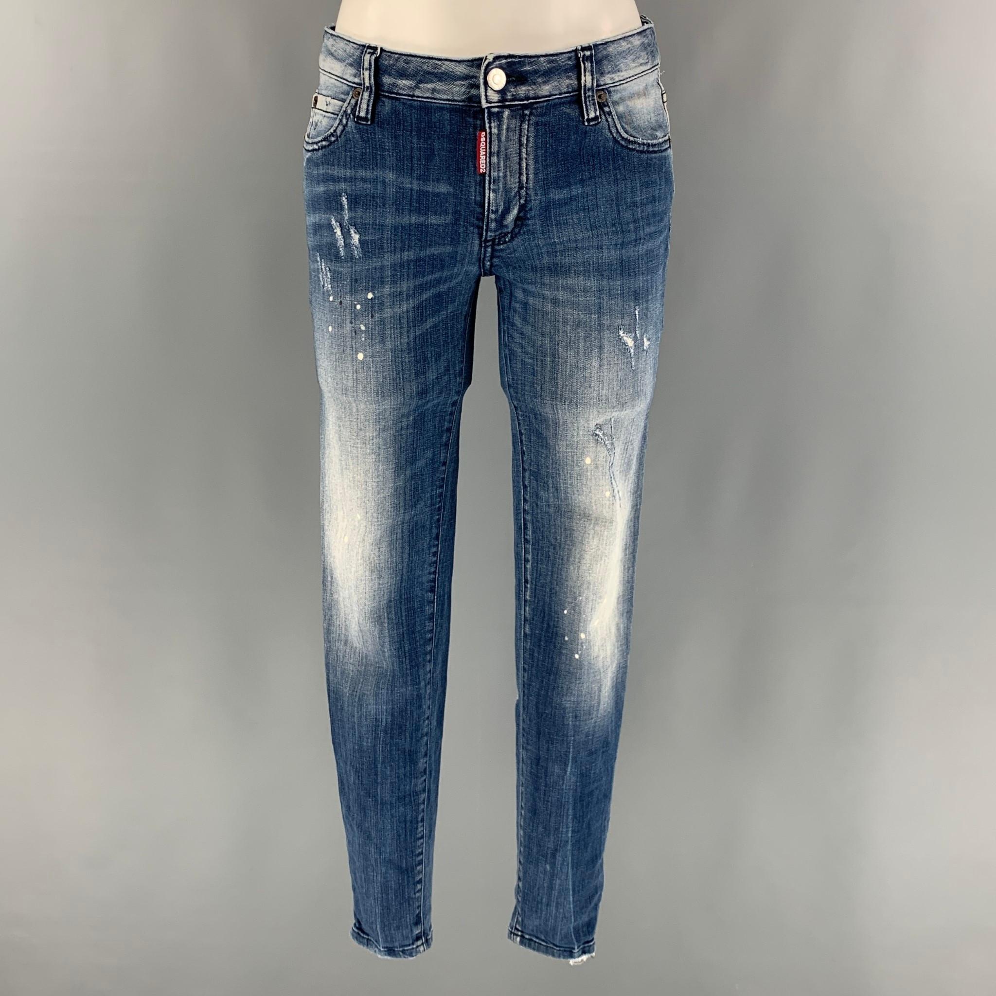 DSQUARED2 skinny jeans comes in a blue cotton and elastane denim featuring a low rise, paint splatter details, and a zipper fly closure. Made in Italy.

Very Good Pre- Conditions.
Marked: 42

Measurements:

Waist: 30 in.
Rise: 7 in.
Inseam: 28 in.  