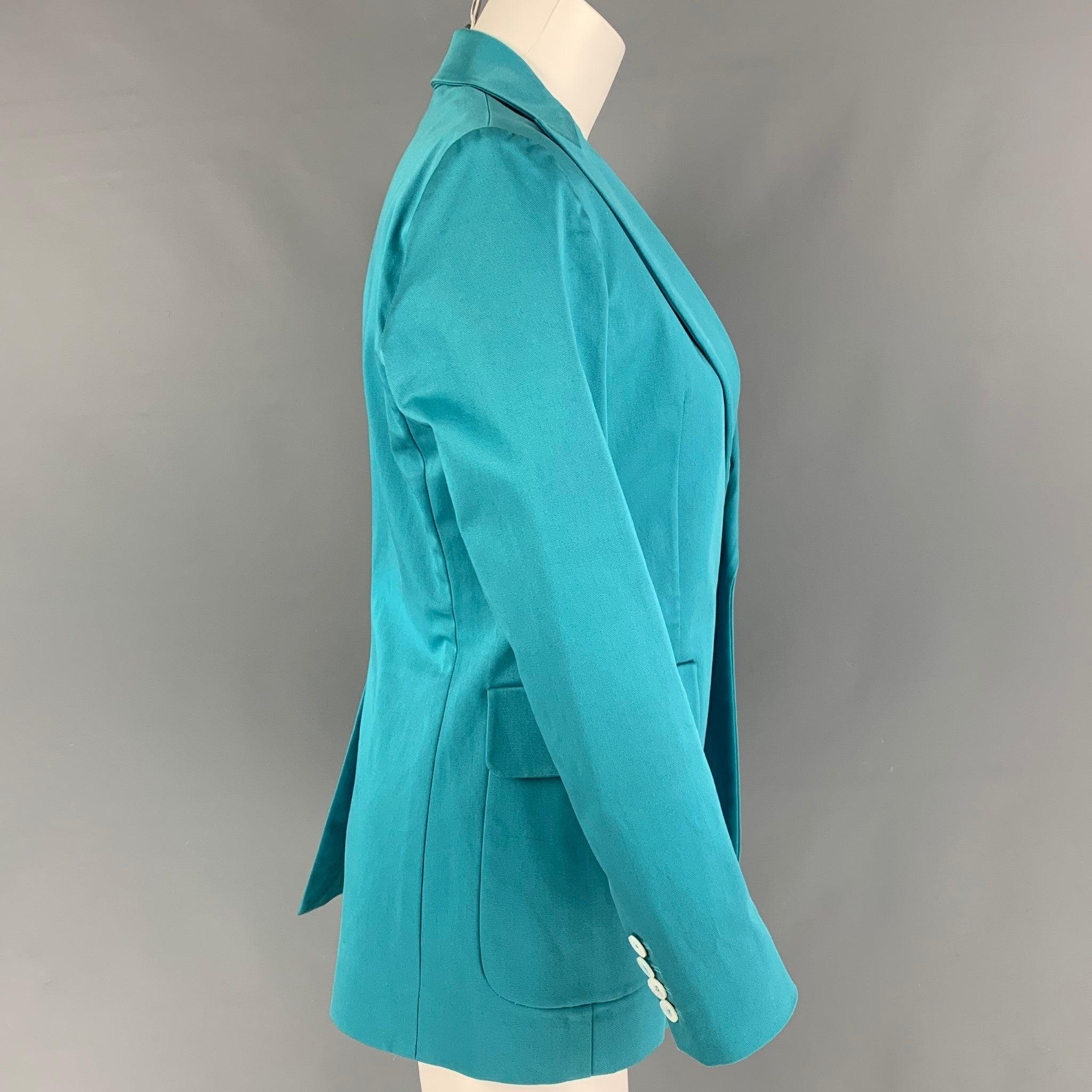 DSQUARED2 blazer comes in a teal cotton featuring a peak lapel, patch pockets, single back vent, and a single button closure. Made in Italy.
Very Good
Pre-Owned Condition. 

Marked:   44 

Measurements: 
 
Shoulder: 15.5 inches  Bust: 36 inches 