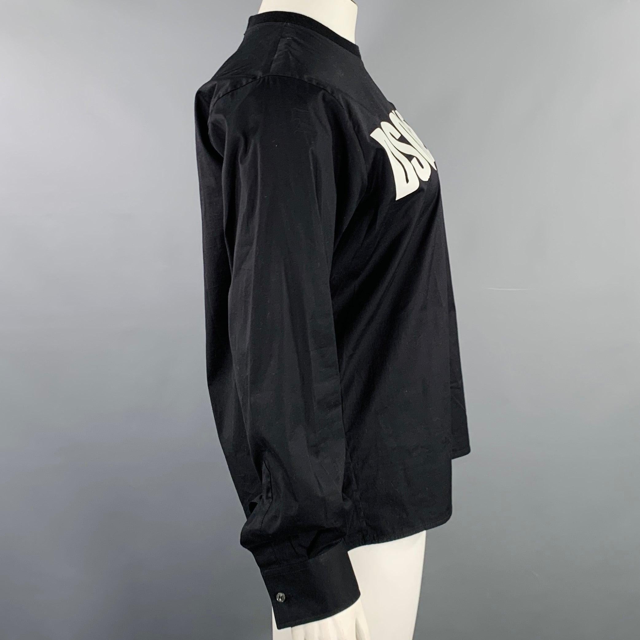 DSQUARED2 pullover
in a black woven fabric featuring white DSQUARED2 logo print, single button cuffed sleeves, and crew neck with invisible zip closure in back. Made in Italy.Excellent Pre-Owned Condition. 

Marked:   IT 46 

Measurements: 
