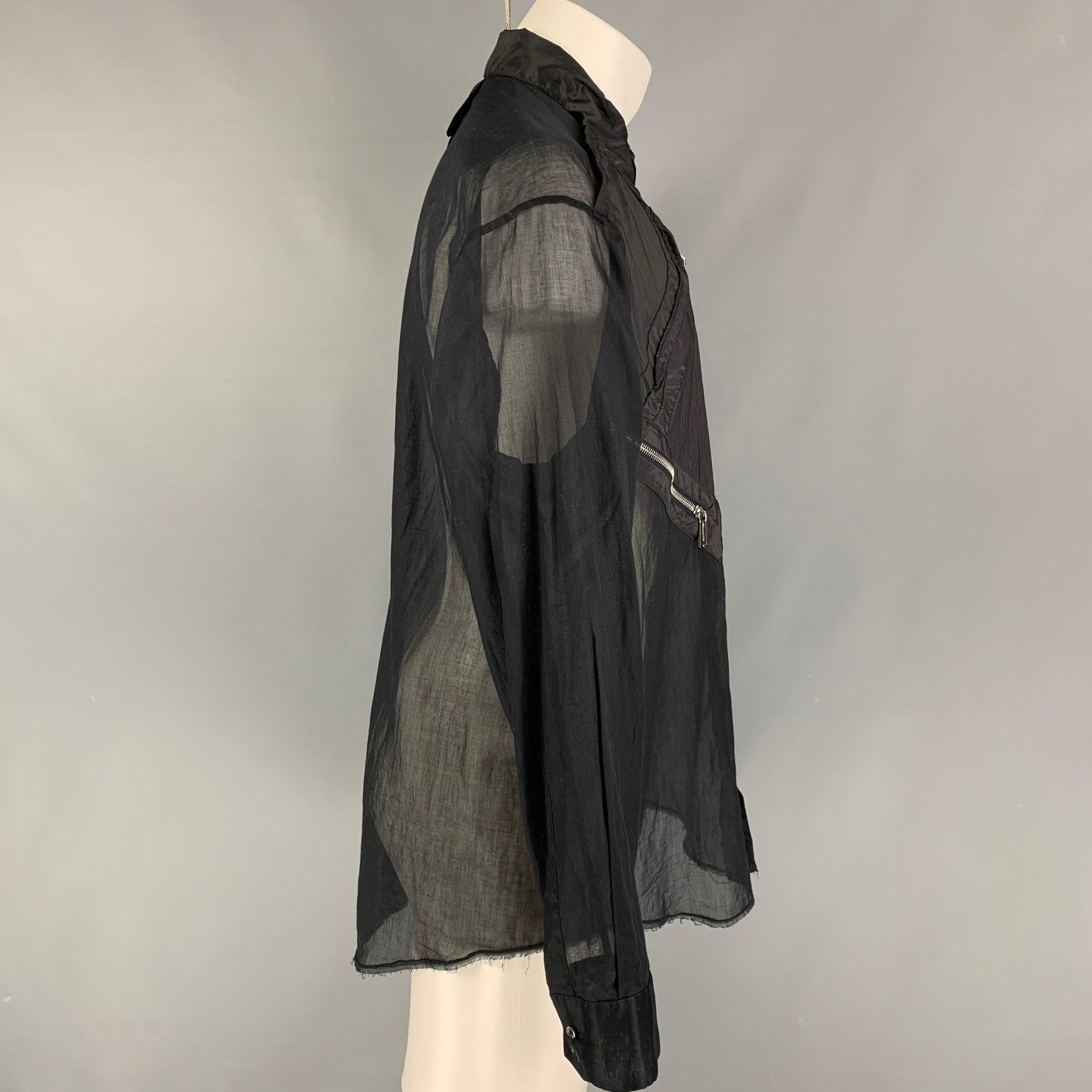DSQUARED2 long sleeve shirt comes in black cotton fabric with a straight collar, button down front, see through look, and zipper details. Made in Italy.Excellent Pre-Owned Condition. Minor signs of uses. 

Marked:   50 

Measurements: 
 
Shoulder: