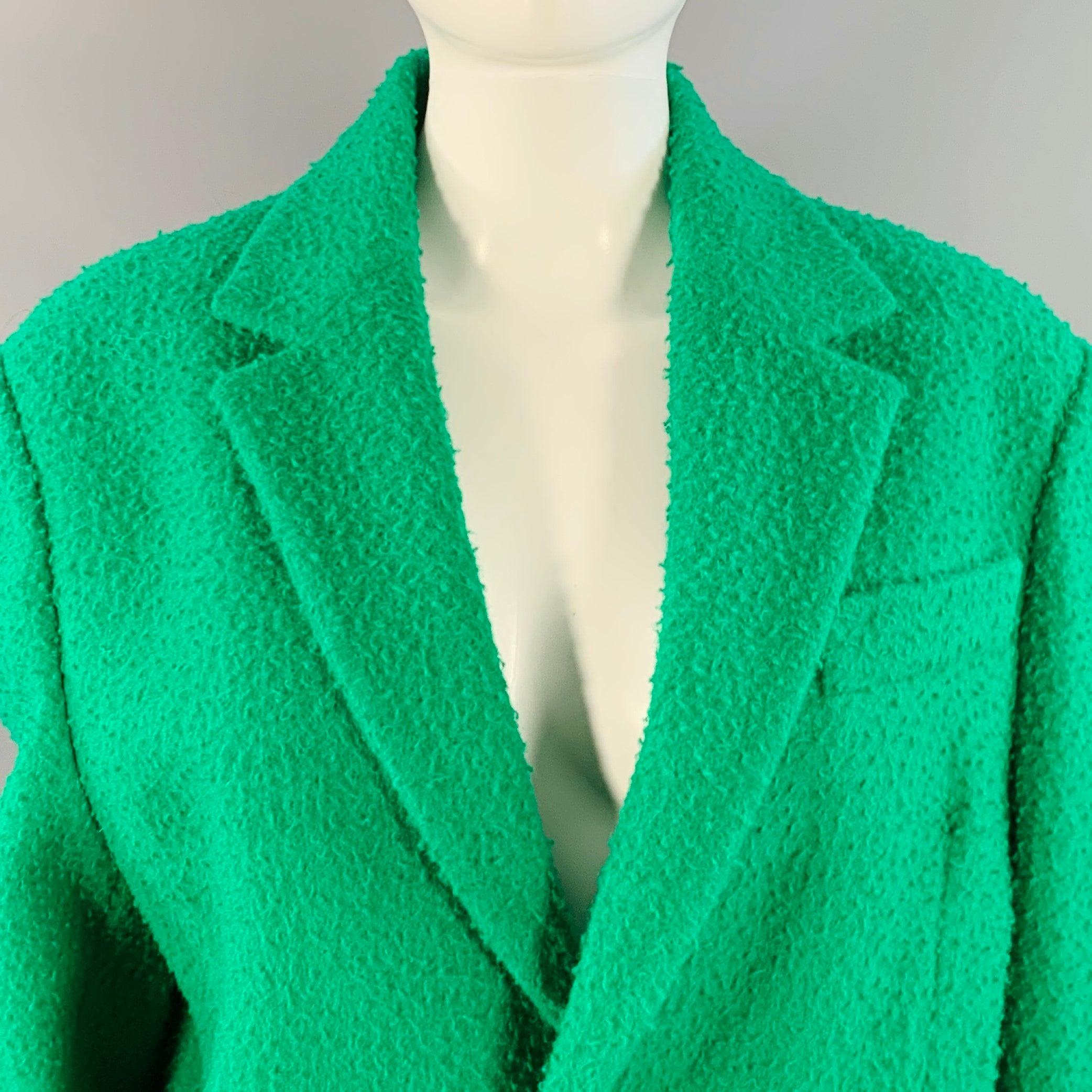 DSQUARED2 Mantel
aus grünem Wollkunstpelz mit Struktur, einreihig, Revers mit Kerbe und Knopfverschluss. Made in Italy Ausgezeichneter Pre-Owned Zustand. 

Markiert:   IT 42 

Abmessungen: 
 
Schultern: 17 Zoll Büste: 42 Zoll Ärmel: 26 Zoll Länge: