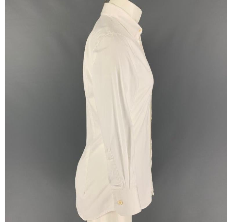 DSQUARED2 long sleeve shirt comes in a white cotton featuring a classic style, spread collar, and a button up closure. Made in Italy.
Very Good
Pre-Owned Condition. 

Marked:   48 

Measurements: 
 
Shoulder: 17.5 inches  Chest: 38 inches  Sleeve: