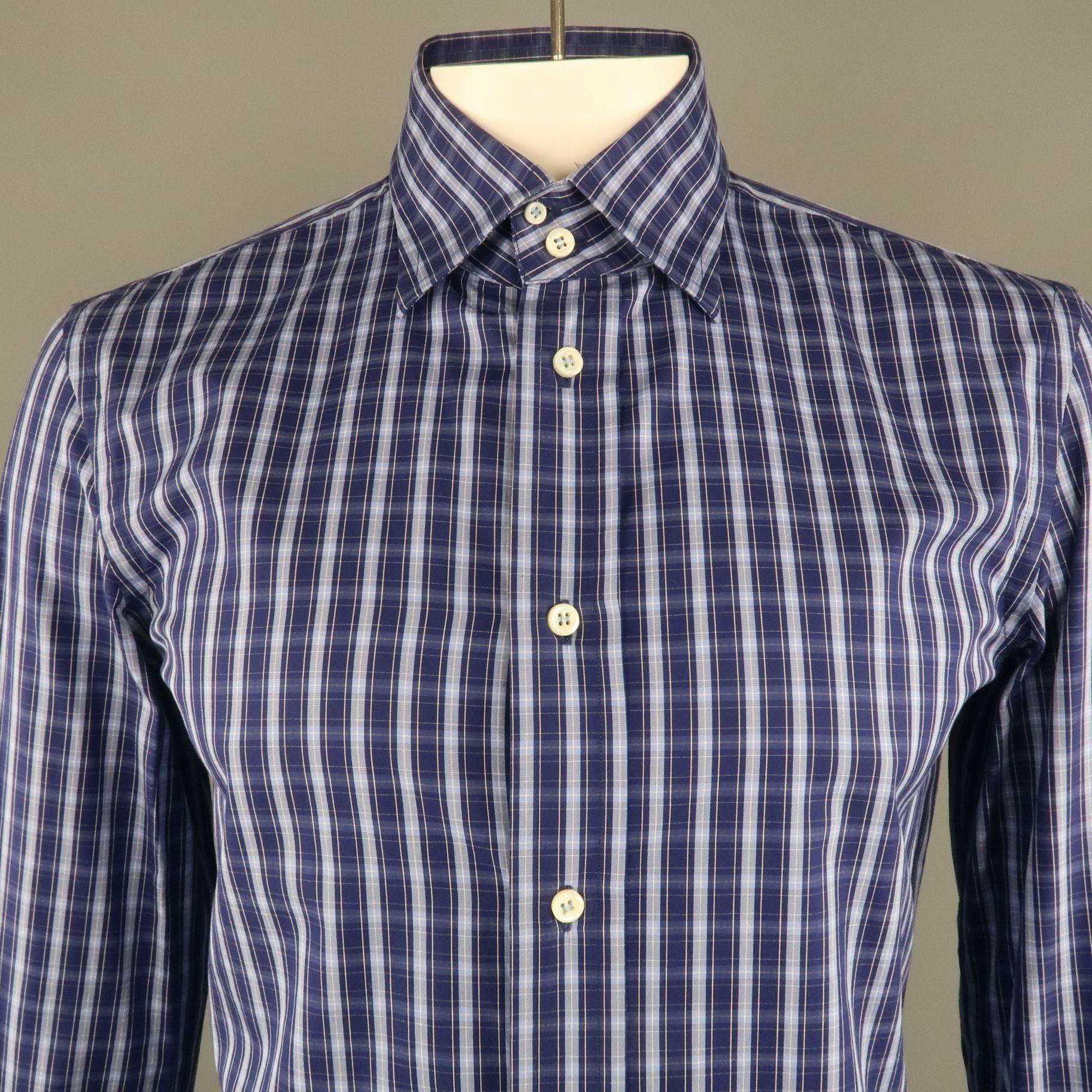 DSQUARED2 long sleeve shirt comes in a navy plaid cotton featuring a spread collar with a three button cuff closure. Made in Italy
 
Excellent Pre-Owned Condition.
Marked: IT 54
 
Measurements:
 
Shoulder: 18 in.
Chest: 42 in.
Sleeve: 26.5