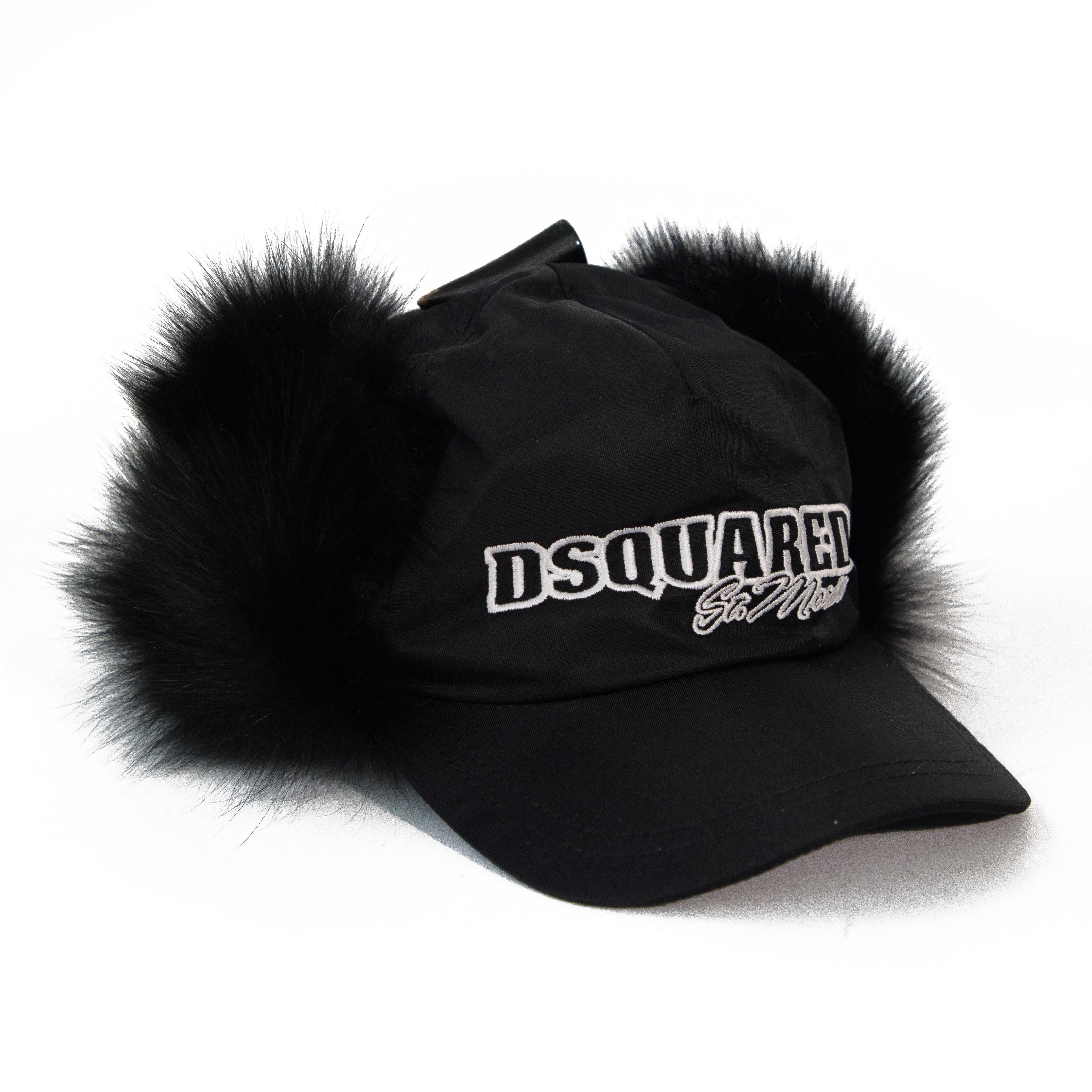Rudr Than The Rest presents a contemporary vintage Dsquared2 nylon cap with fox fur.

Black on black nylon exterior and fur.

Quilted interior.

Fold-down Fox fur ear muffs.

Wood effect and leather toggle on the top.

Made in Italy.

Provenance: