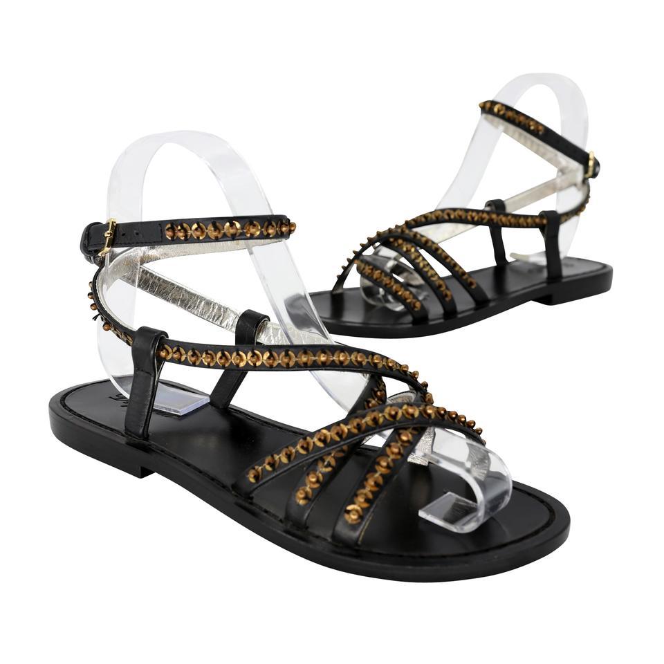 A combo of Tribal Beads and rocking Straps. These amazing Dsquared sandals are a must have for any fashionista. The zipper includes gold studs pull tab for easy on/off. The soles have scuffing and signs of wear throughout. The uppers are clean with
