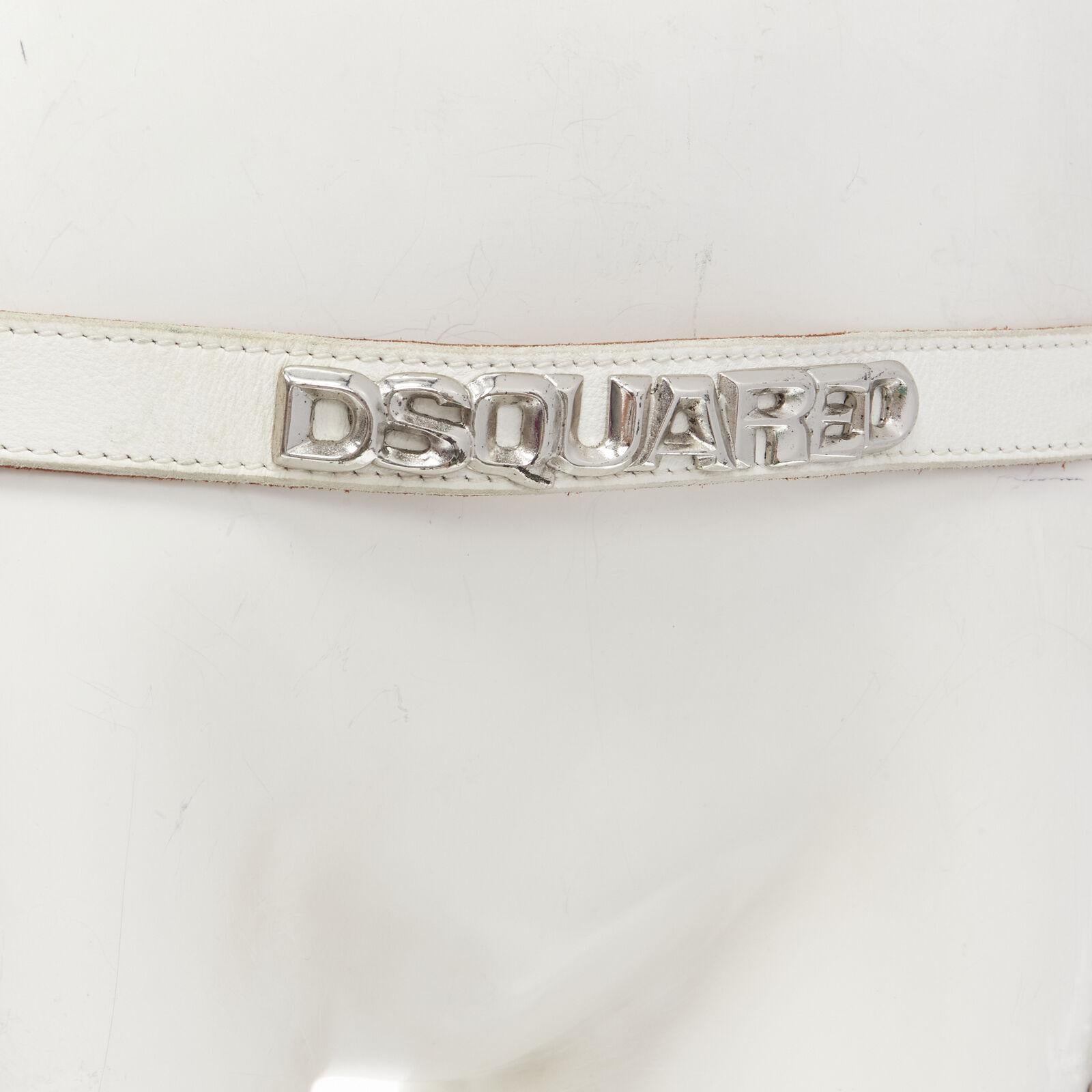 DSQUARED2 Vintage Y2K white logo leather silver bulldog helmet chain punk belt
Reference: ANWU/A00888
Brand: Dsquared2
Material: Leather
Color: White, Silver
Pattern: Solid
Closure: Snap Buttons
Made in: Italy

CONDITION:
Condition: Fair, this item
