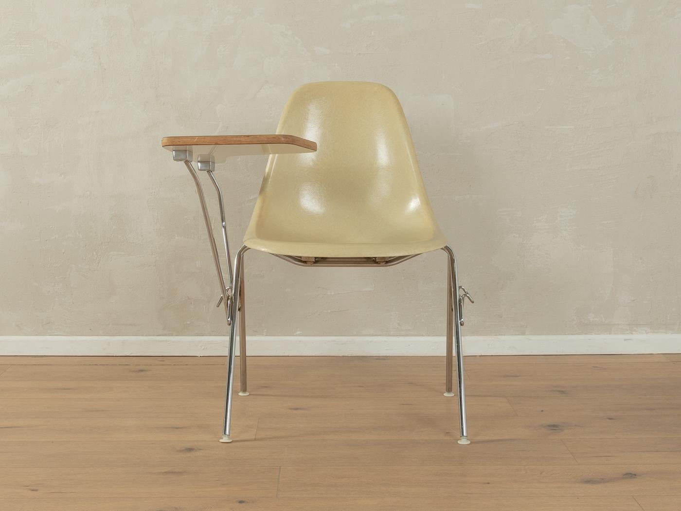 DSS-TA chair by Charles & Ray Eames for Herman Miller from the 1960s. Stainless steel frame with fibreglass seat shell and a foldable table top made of Micarta and plywood with Formica coating in white.

Quality Features:
accomplished design: