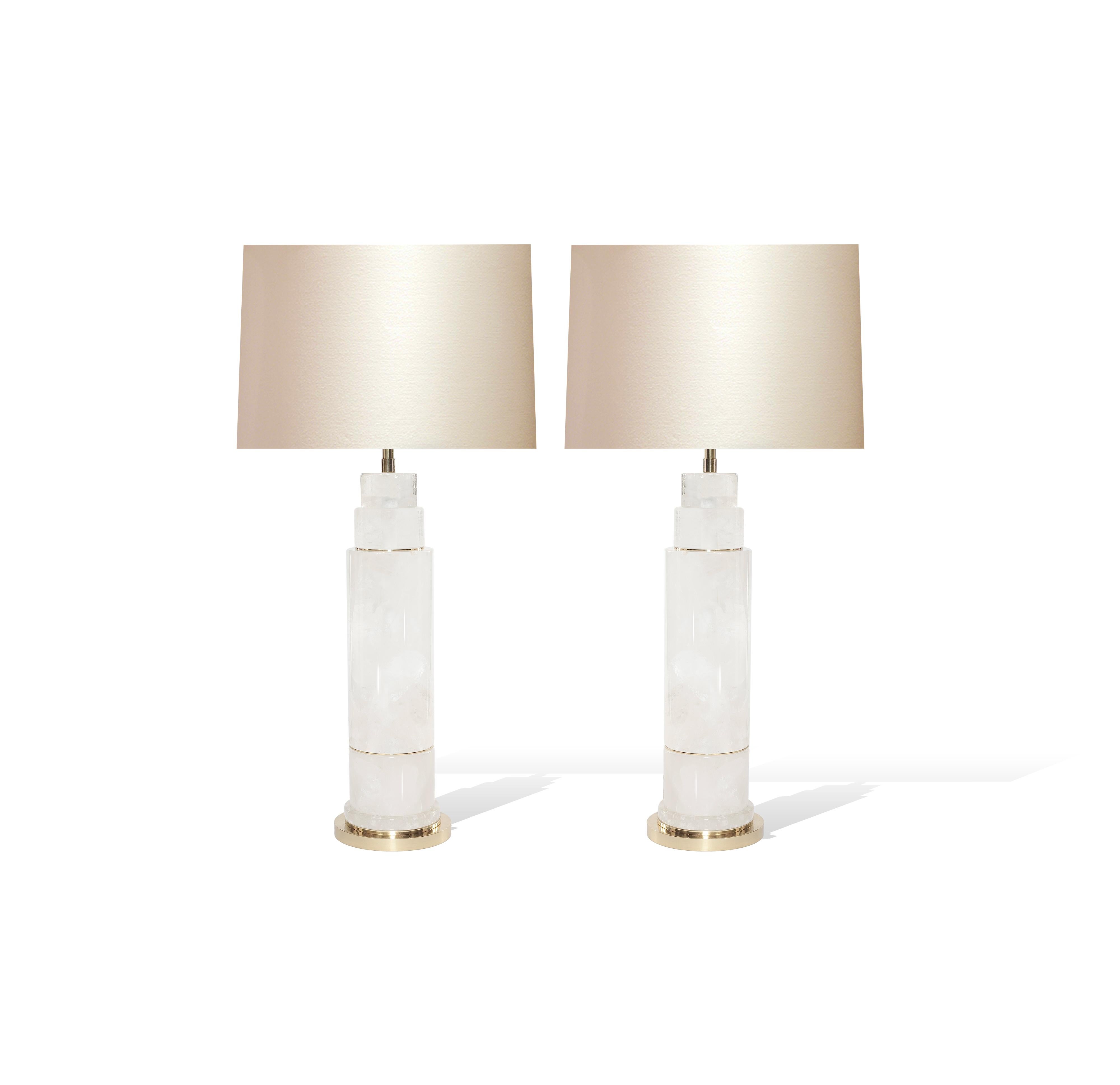 Pair of sectional column rock crystal lamps with polished brass inserts and bases. Created by Phoenix Gallery, NYC.
To the top of rock crystal: 17”/H
(Lampshade not included.)
