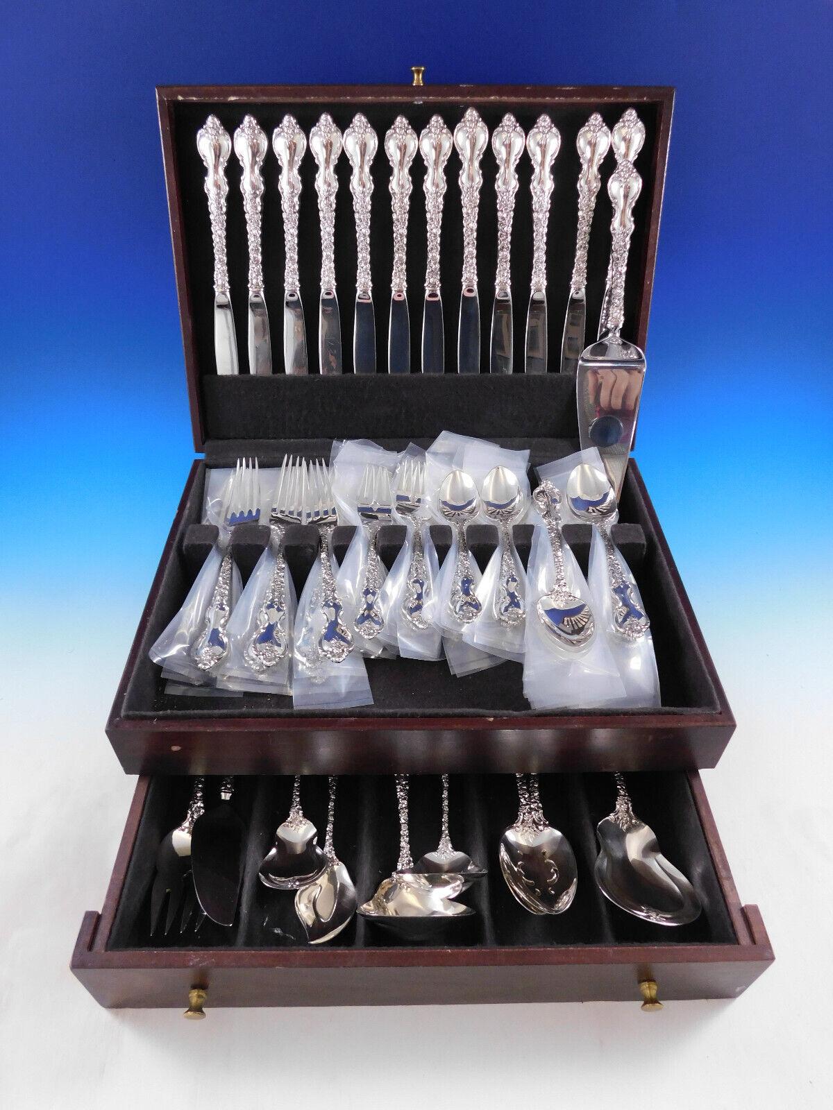 Dinner Size Du Barry by International sterling silver Flatware set, 70 pieces. This set includes:

12 Dinner Size Knives, 9 3/4