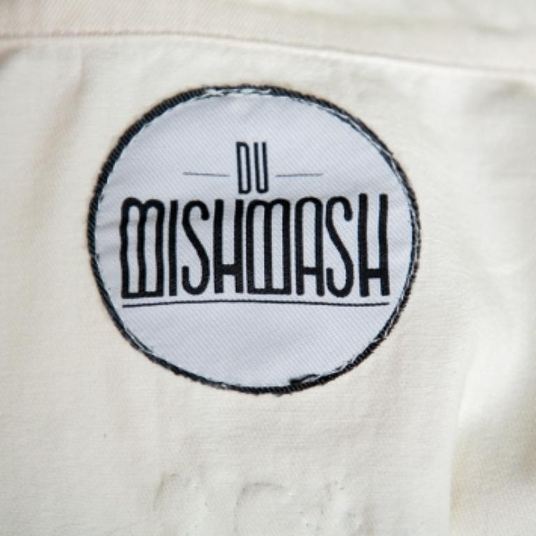 We are singing praises for this jacket from Du Mishmash as it is well-made and beautiful to look at. It arrives made from quality denim and designed with embellishments on the back. It has a front zip, epaulets and long sleeves. Be sure to team it