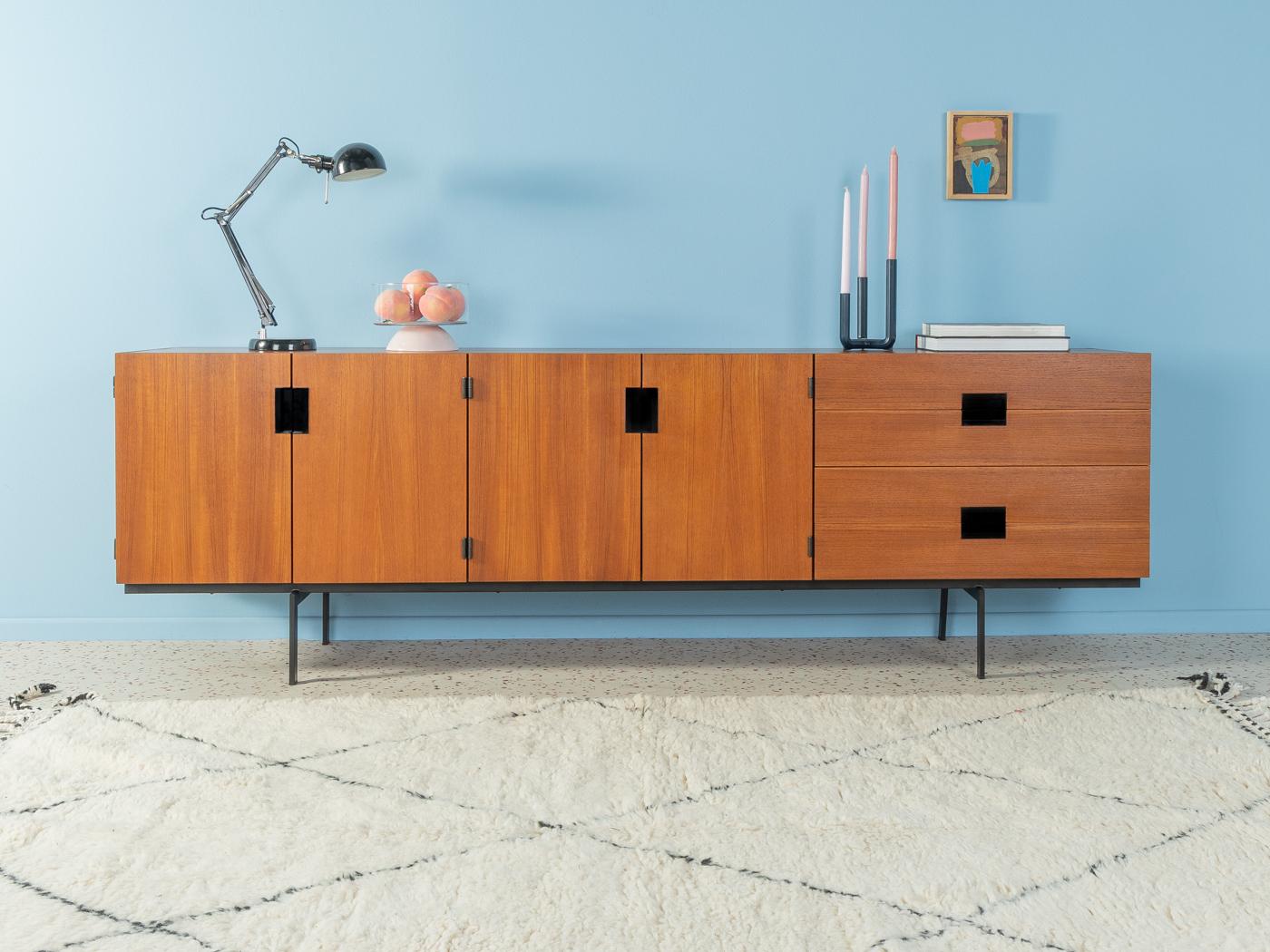 DU03 sideboard from the Japanese Series by Cees Braakman for Pastoe. Corpus in teak veneer with four drawers, four doors, two shelves and black steel feet.

Quality Features:

    accomplished design: perfect proportions and visible attention to