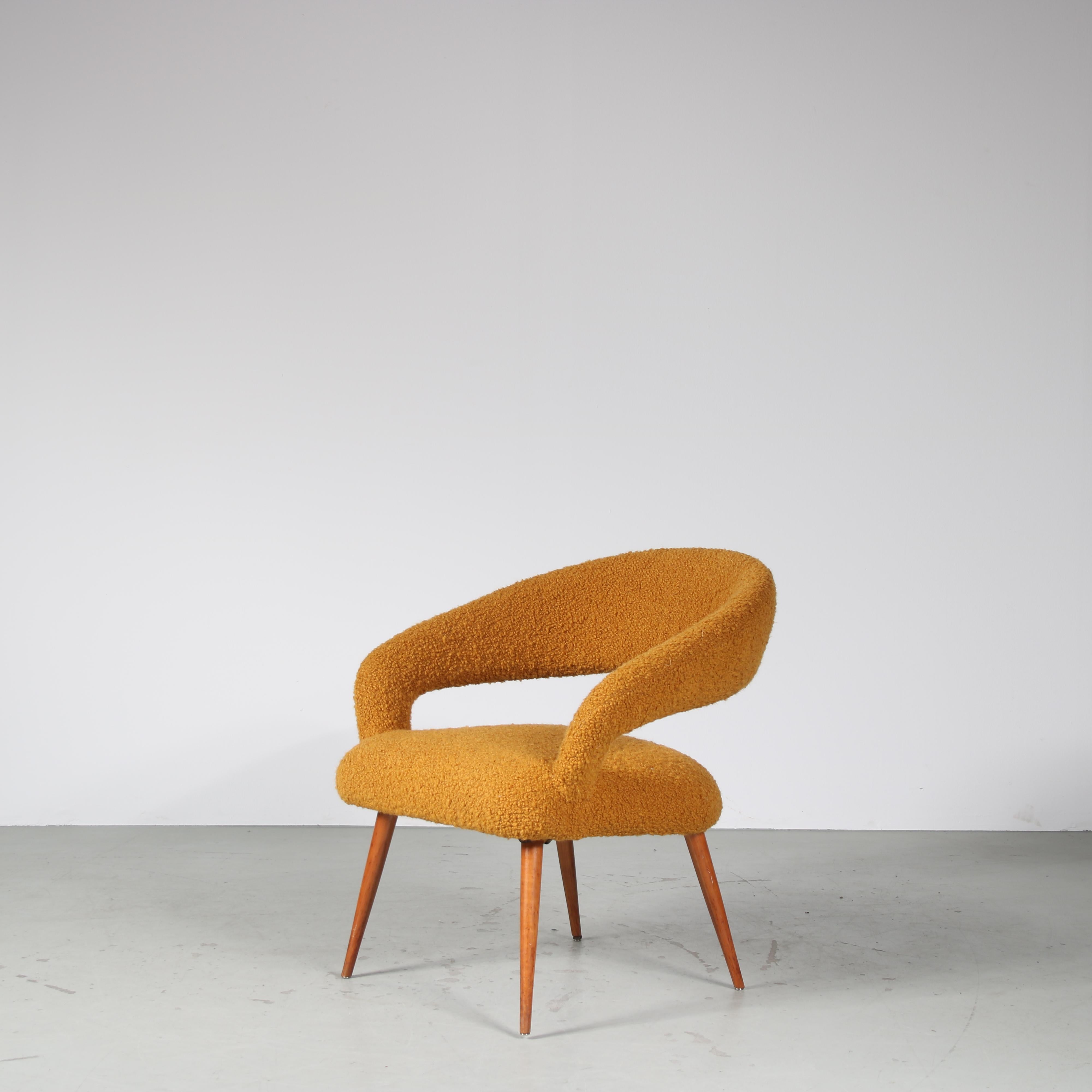 A lovely elegant easy chair, designed by Gastone Rinaldi and manufactured by RIMA in Italy around 1950.

The beautifully curved seat rests on four gently tapered wooden legs. This all adds nicely to the luxurious style of the piece, fantastically