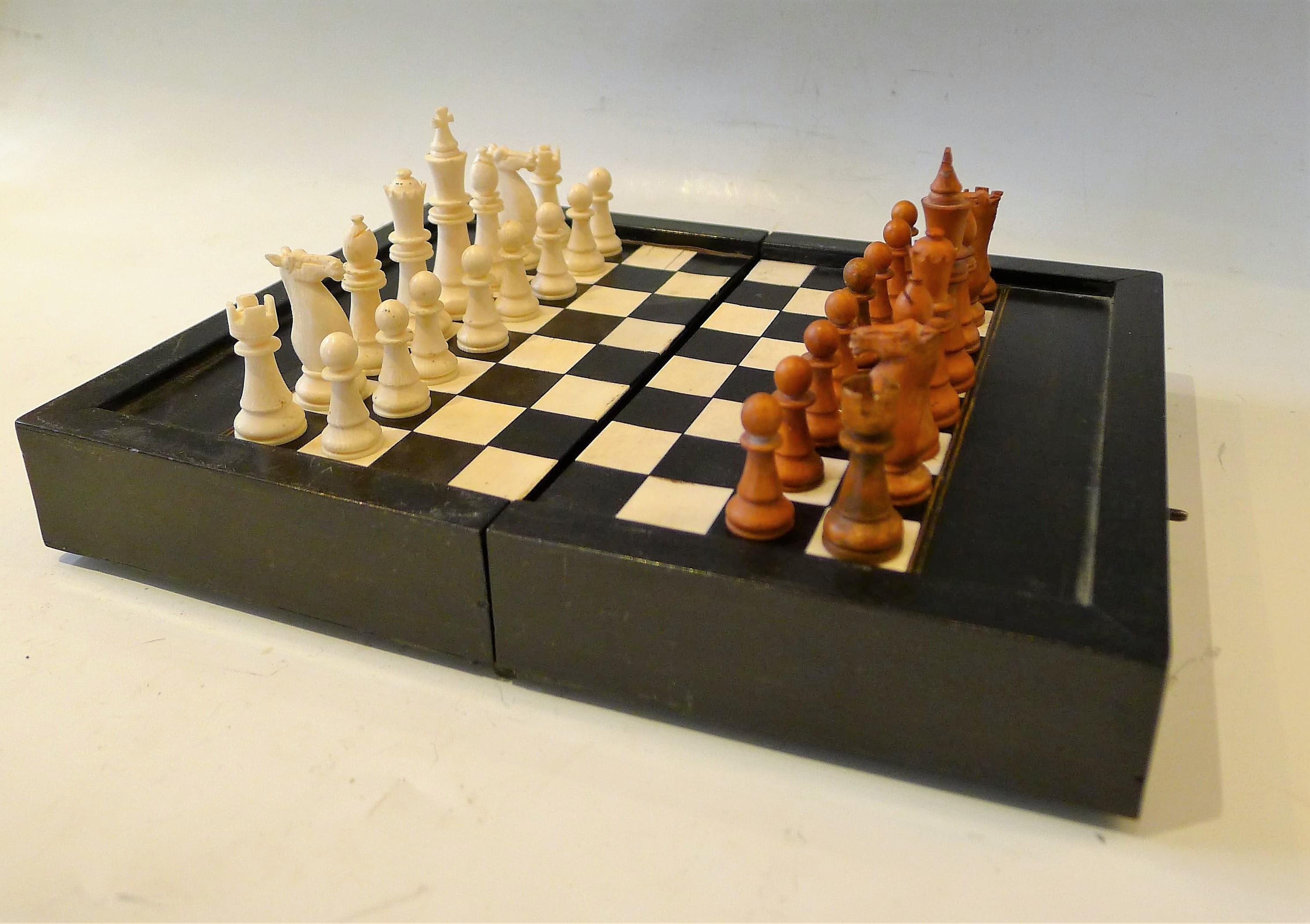 Dual chess and Backgamon wooden travel set.
Game pieces in ebony and bone.
Nice claps.

