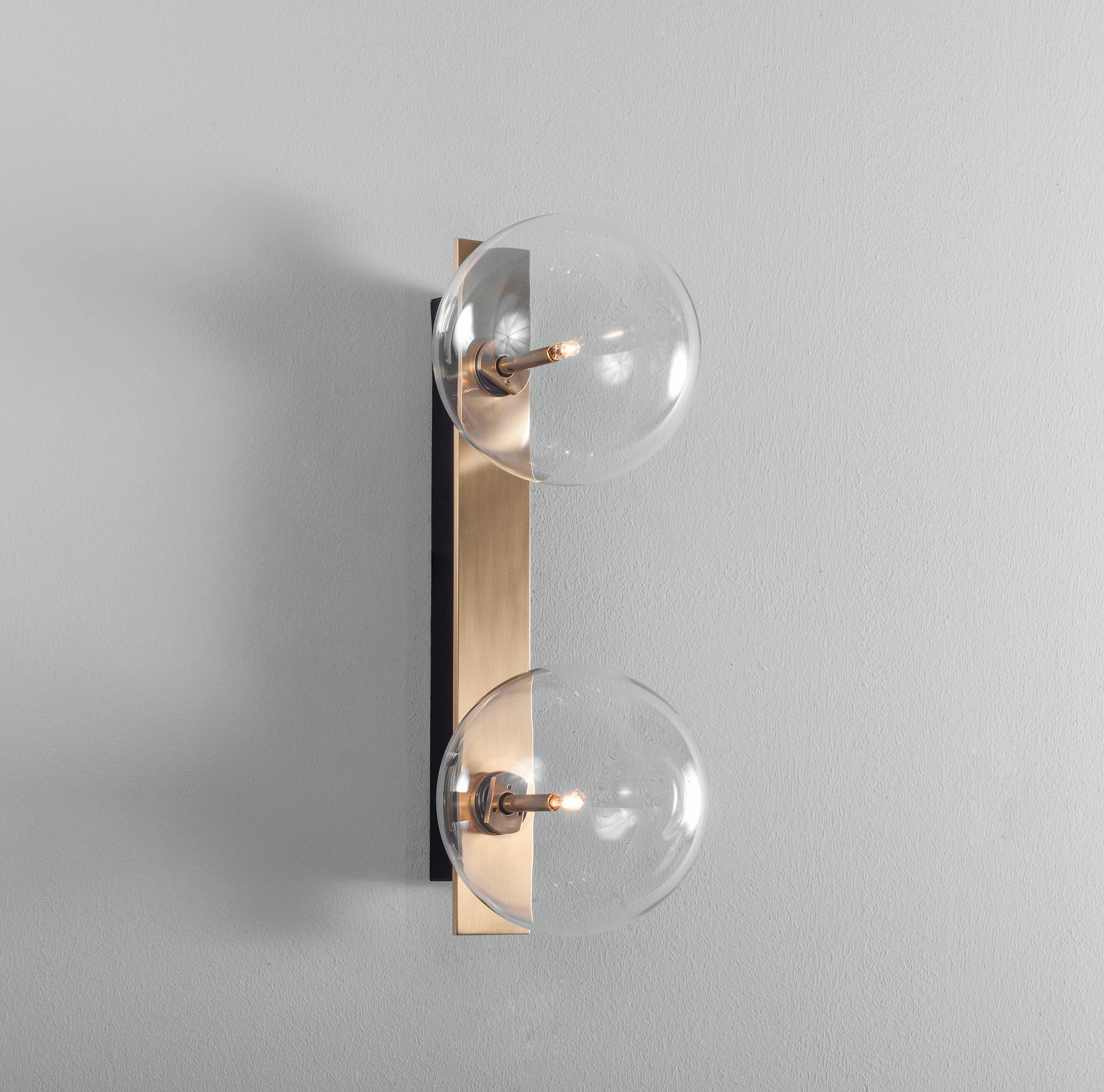 Oslo Dual Brass Wall Sconce by Schwung
Dimensions: W 15 x D 19 x H 40 cm
Materials: Solid brass, hand blown glass globes

Finishes available: Black gunmetal, polished nickel, brass


Schwung is a German word, and loosely defined, means energy or