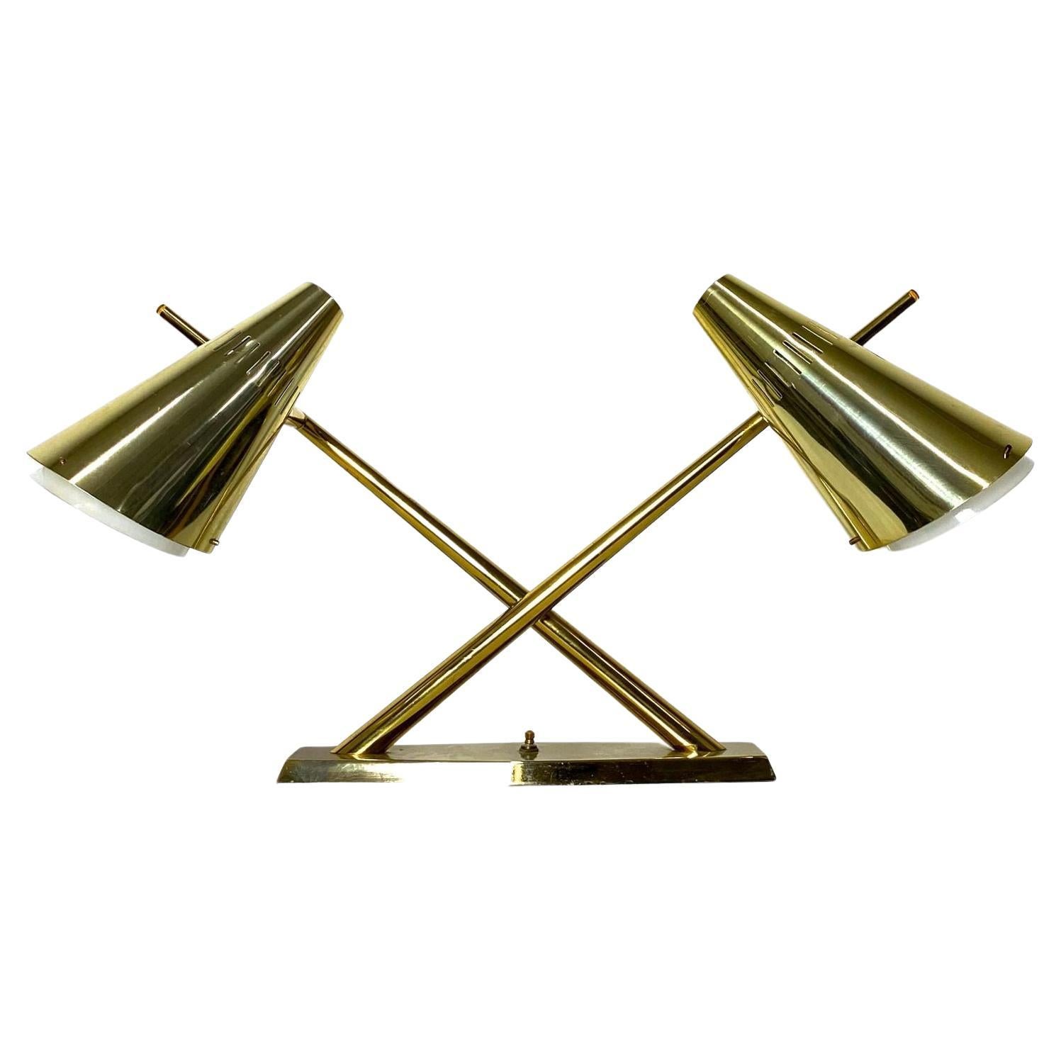 Laurel Brass and Glass Dual Cone Desk Lamp 1960s

Rare articulated shade desk lamp by Laurel Lamp Company circa the 1960s
X form design with dual cone shades in brass over opaque glass diffuser
360 degree pivot joint for custom directional