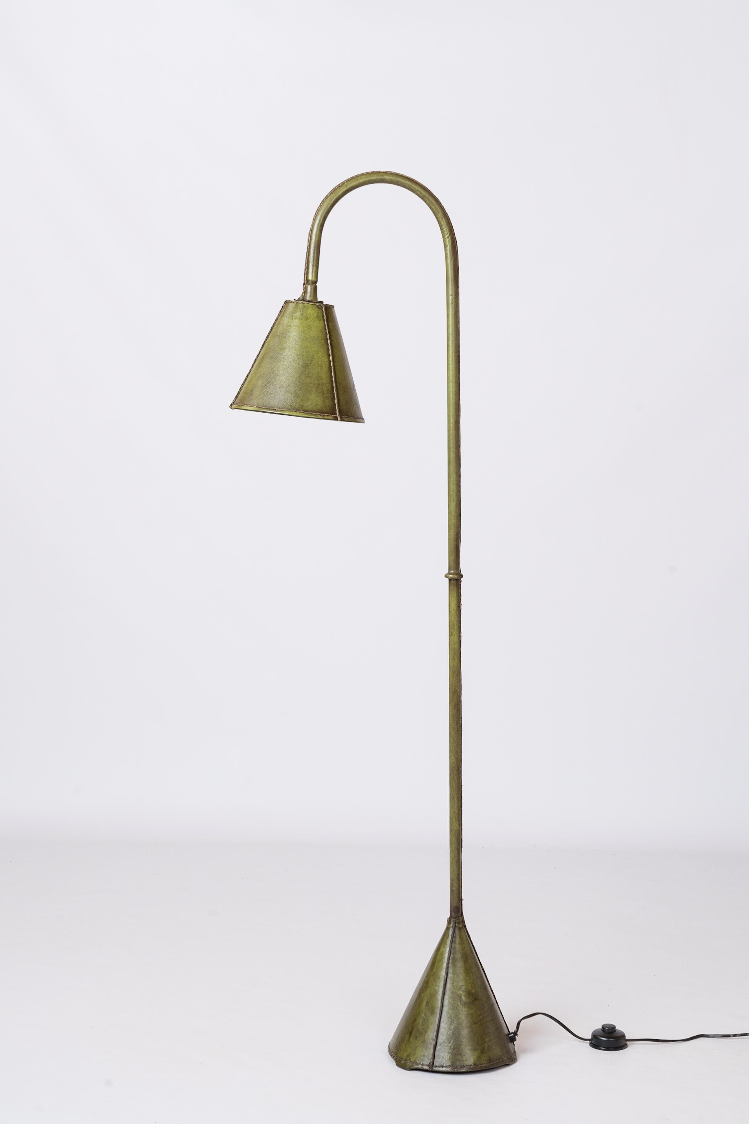 Iconic all olive green leather dual cones floor lamp by Valenti, Spain. Reminiscent of Jacques Adnet's designs.
European socket and wiring.
This lamp will ship from France and can be returned to either France or to a LIC NY location.
Price does not