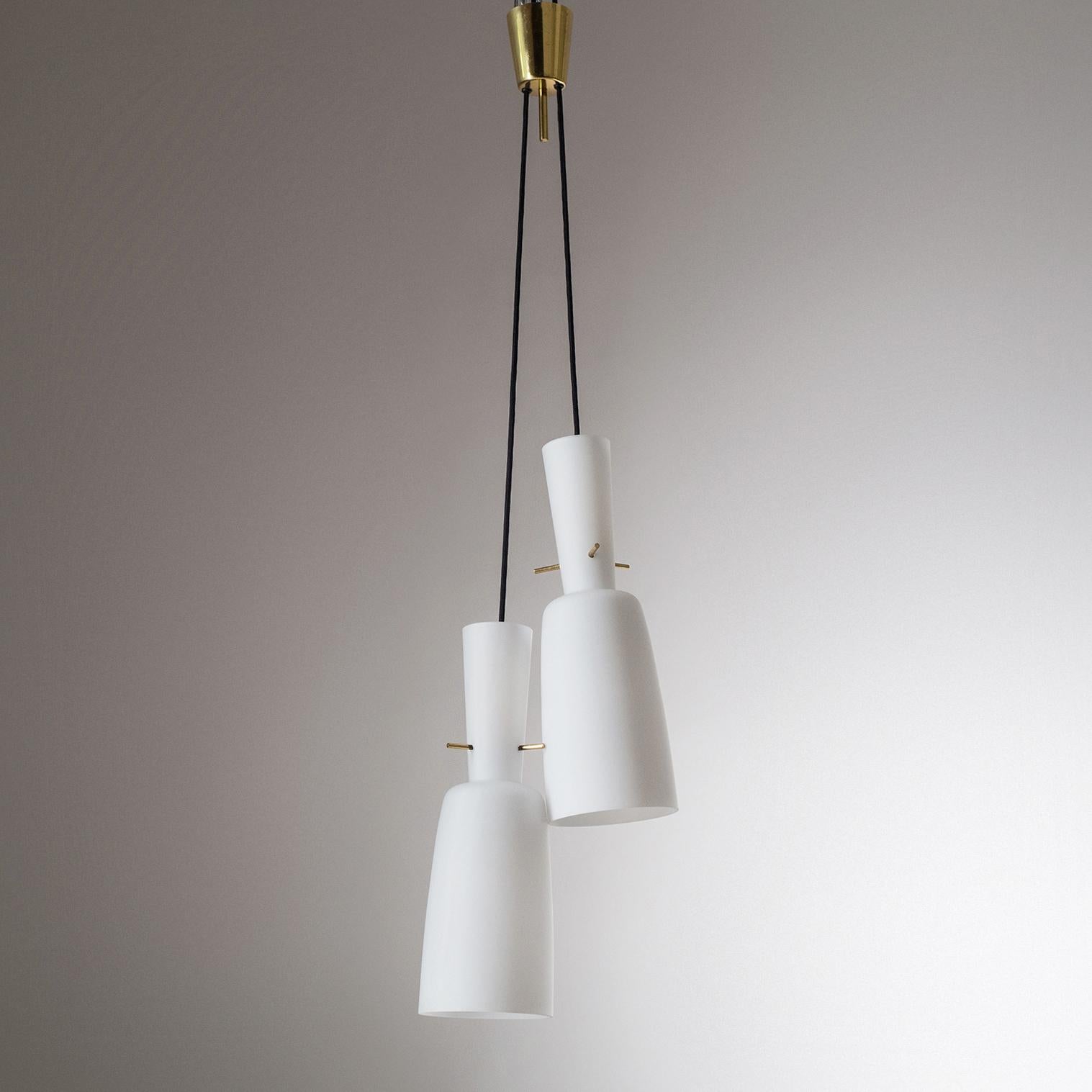 Rare dual-glass version of model 3183 pendant by J.T. Kalmar, 1950s. Two satin glass diffusers from a single canopy can be individually adjusted in height. Very good original condition with a light patina on the brass parts. Two original brass E27