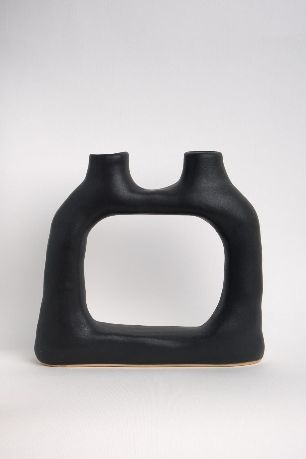 Ceramic sculptural vase from the permanent collection.

Dimensions: 23 x 8 x 19.