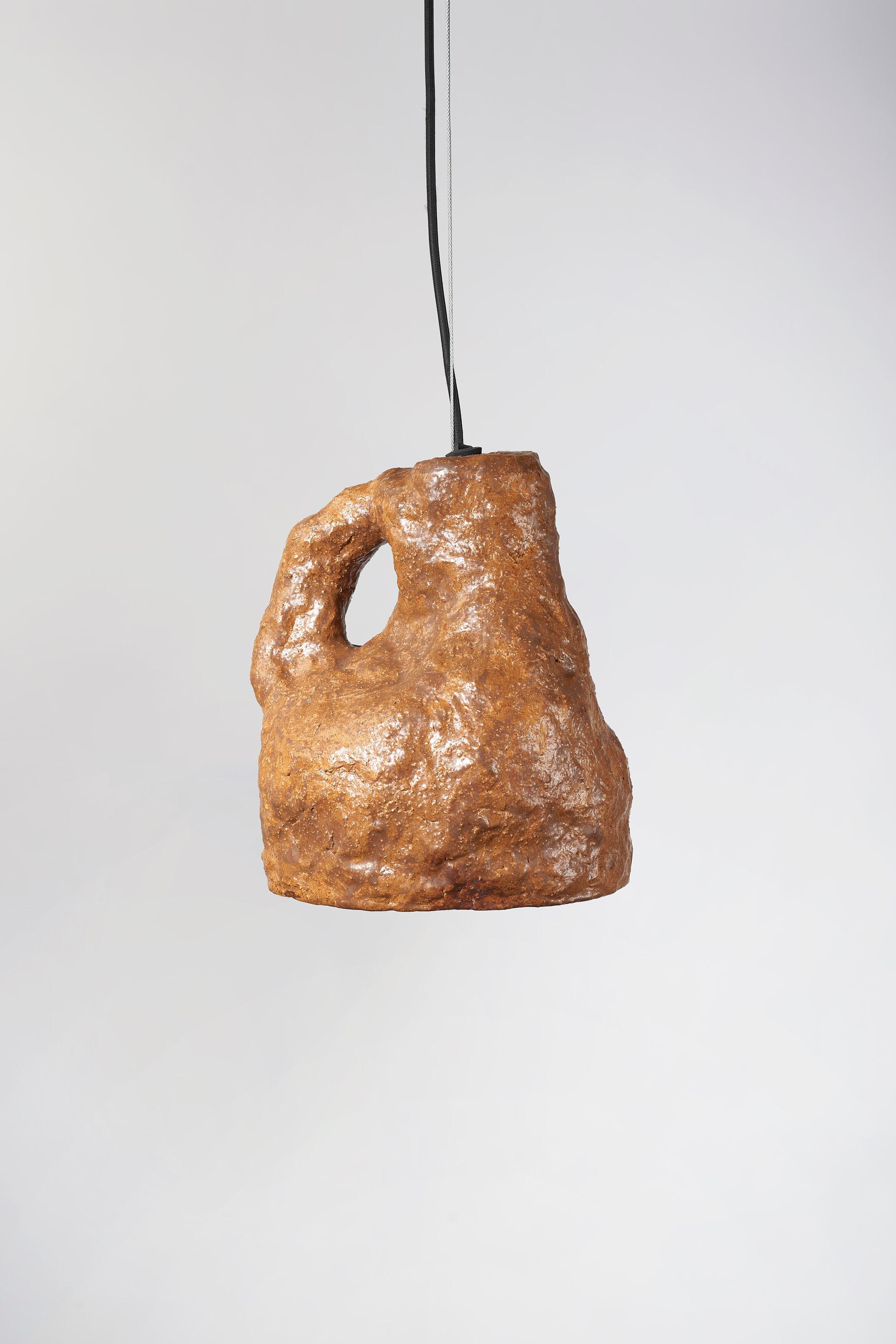 Dual lamp brown medium by Willem Van Hooff
Dimensions: W 25 x H 30 cm (Dimensions may vary as pieces are hand-made and might present slight variations in sizes)
Materials: Earthenware, ceramic, pigments and glaze
Also available in different colours: