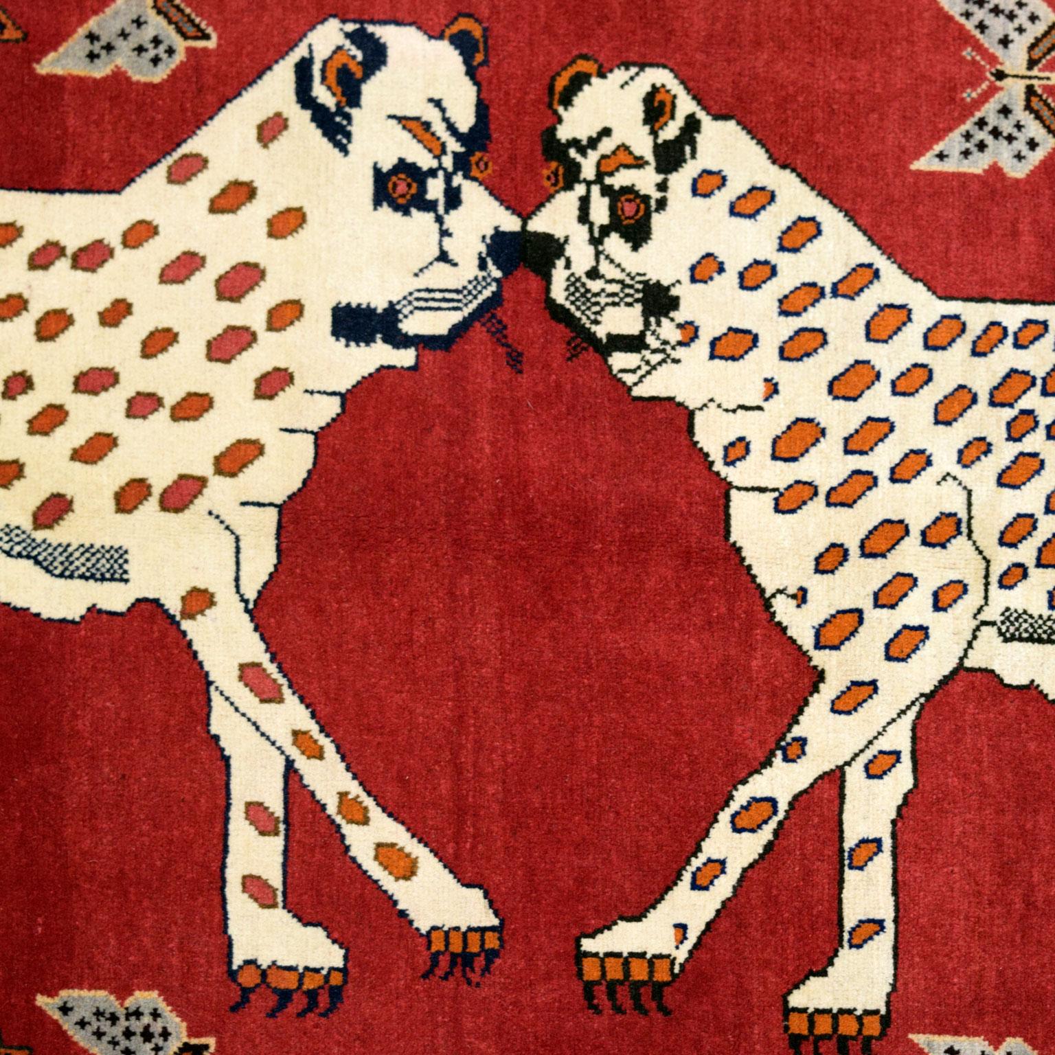 Measuring 4’ x 6’3”, this Persian Leopard Carpet is hand-knotted and belongs to Orley Shabahang’s World Market Collection. The design is unique, featuring a distinctive, dual leopard motif, with the leopards facing one another. Their neutral cream