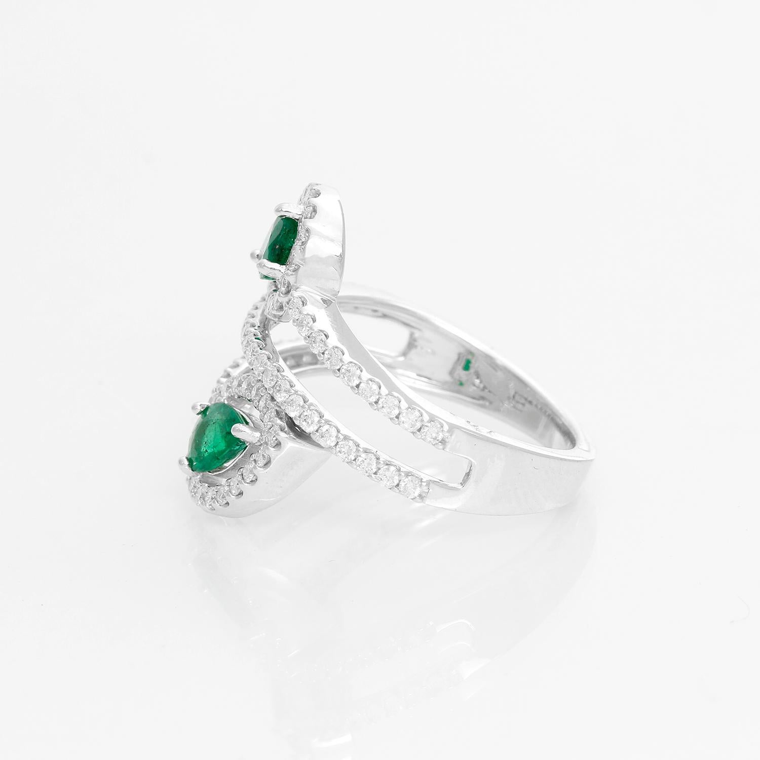 Dual Pear Emerald 14K White Gold Ring Size 7  - This charming composition balances a pair of pear-shaped color stones along detailed diamond accents at every glance. Weighing  0.68 cts of  Emerald pear-shaped stone suspended by diamond halo. Total