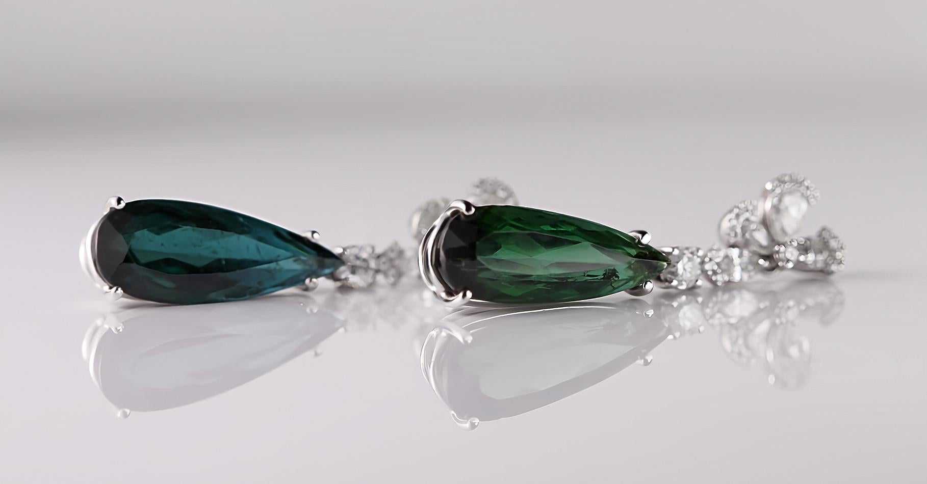 Discover the craftsmanship and elegance of these earrings crafted in 18kt white gold with a total weight of 8 gr. 

Featuring two natural Tourmalines cut in a drop shape, they showcase slightly different original hues: one leaning toward green while