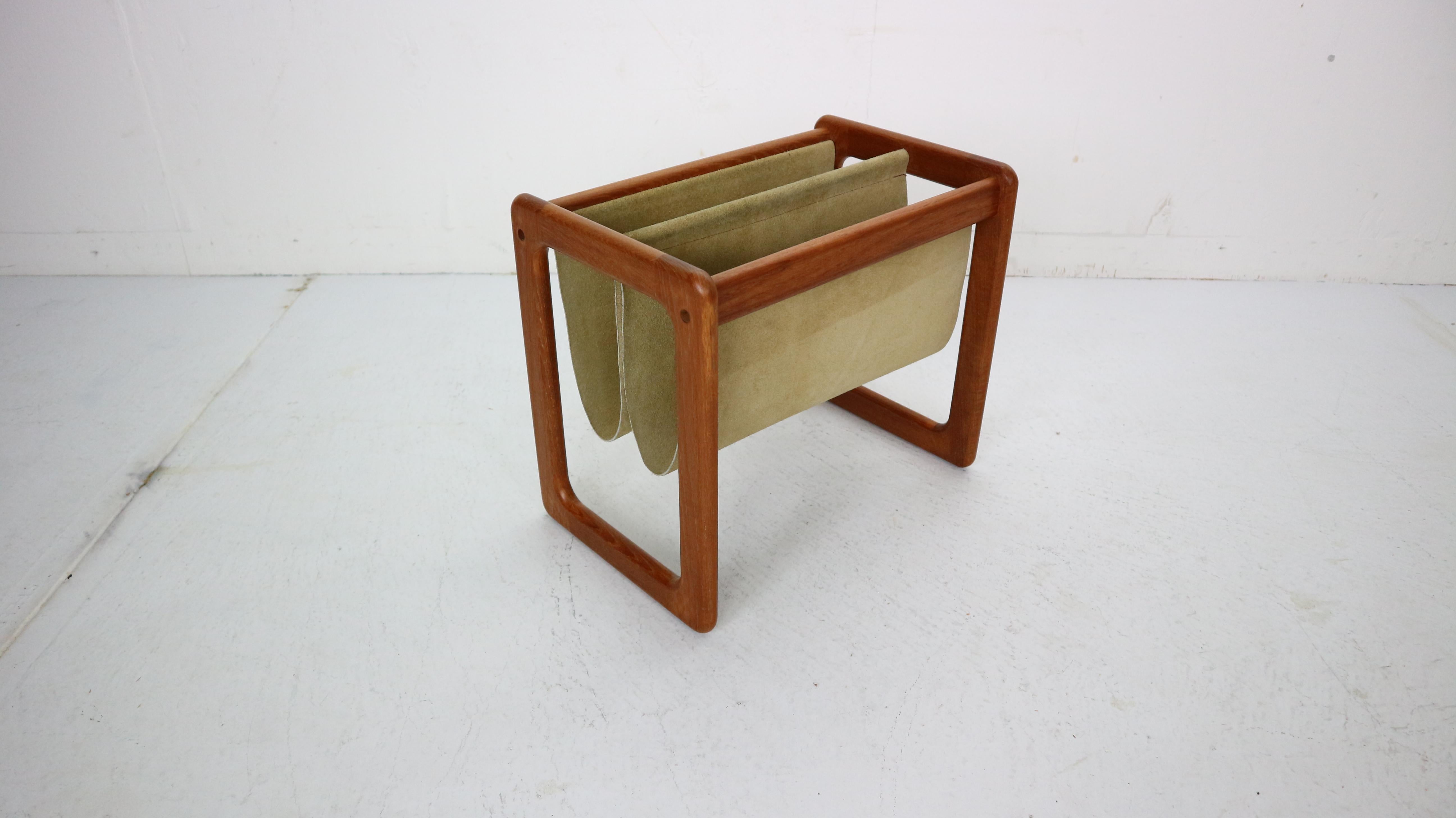 Beautiful magazine rack designed by Aksel Kjersgaard in 1960s period, Denmark.
Solid teak frame. Dual light green suede leather cradle slings for your literature.
Minimalistic Danish design.