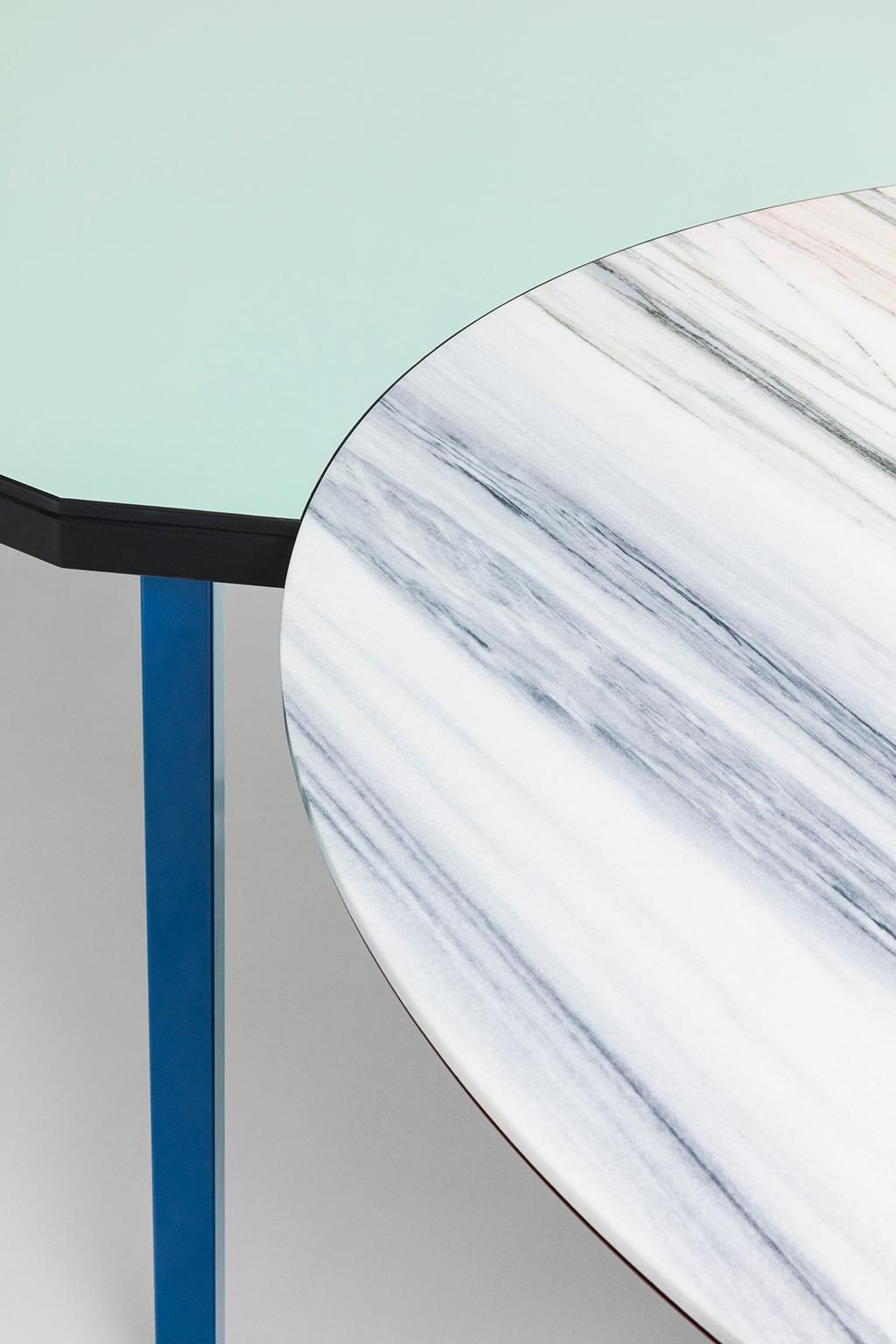 Duale table is in fact two tables in one: the round top is in Lasa white marble, taken from Croda di Jenn quarries at 1500 meters above sea level, the rectangular top (cm 128 x 186) is made laminate. The huge support structure consists of an