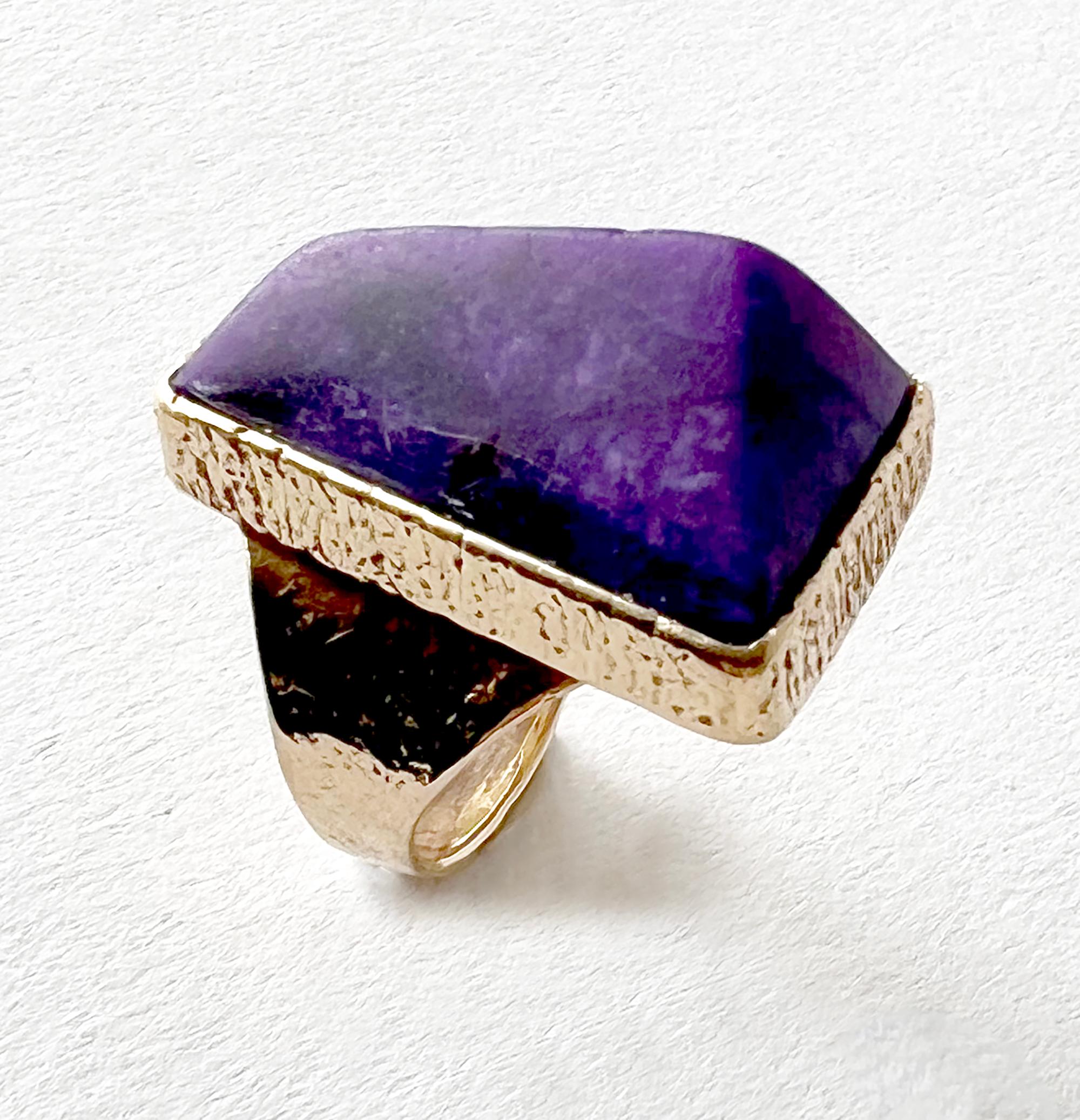Bezel set, pyramidal shaped chariot stone set in 14k yellow gold tufa cast ring with hammered textured finish created by Duane Maktima of Santa Fe, New Mexico.  Ring is a finger size 7 and signed with the artists' hallmark, 14K.  Stone measures