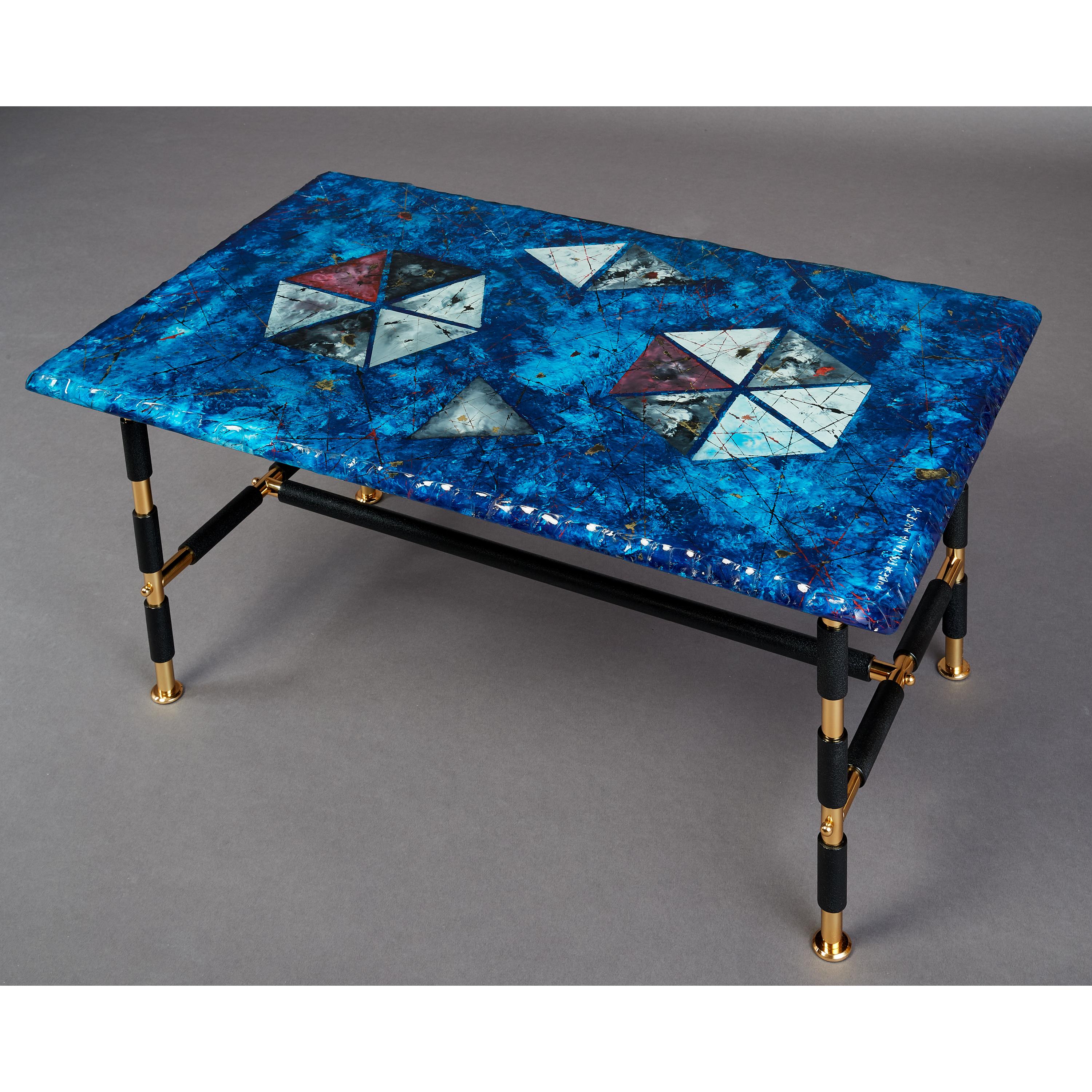 Dube for Fontana Arte.
Duilio Barnabe (1914-1961)
A stunning Fontana Arte coffee table, with chiseled edge back painted glass top by Duilio Barnabe in rich shades of blue, red, gold and abstracted decor.
Italy, 1950's
Measures: 35 W x 21.5 D x 17 H.