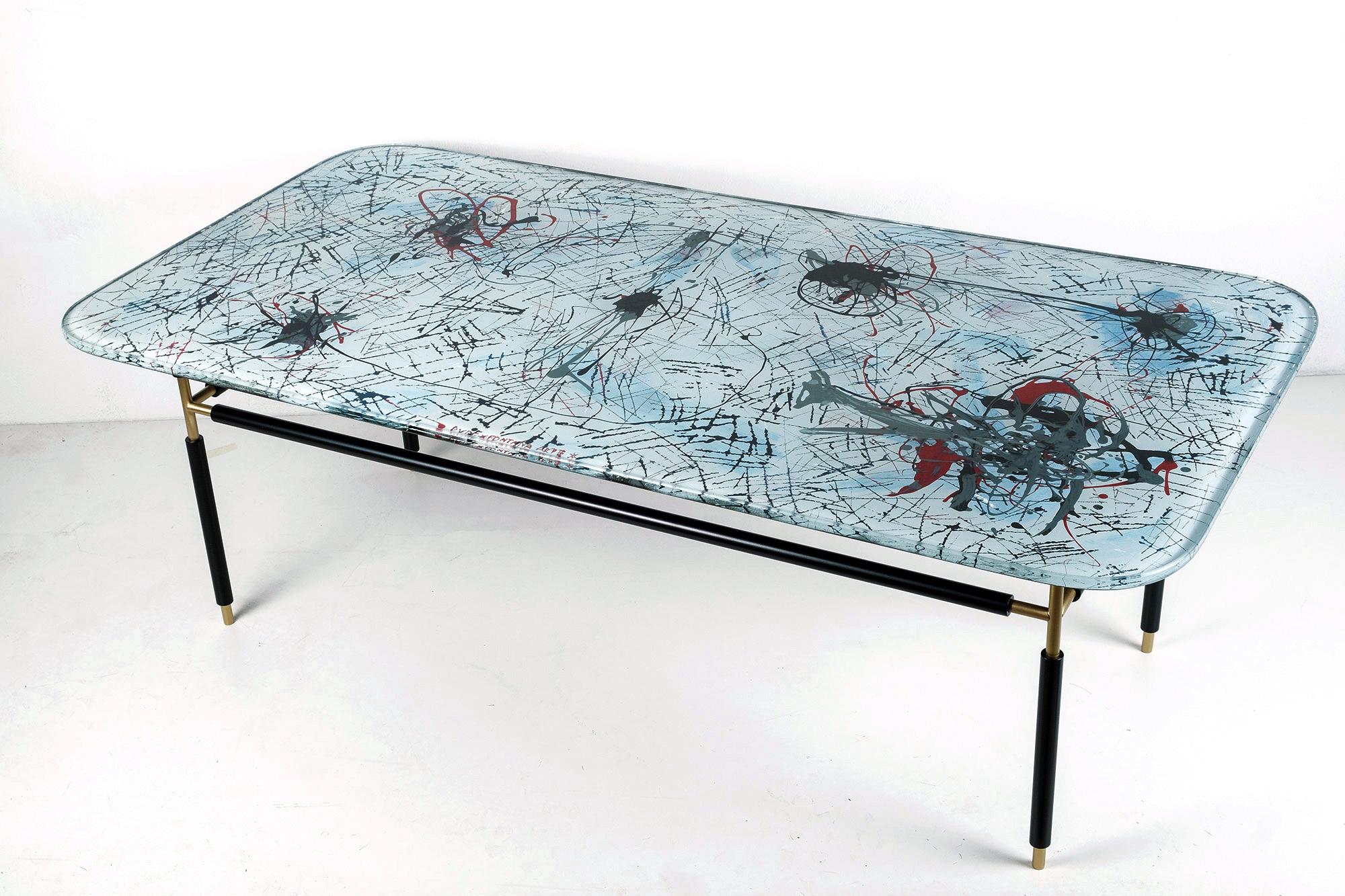 Stunning coffee table, Églomisé glass (back painted) by italian artist Dubé (Duilio Barnabé) on a brass structure. 
Fontana Arte, Italy, 1950’s.
