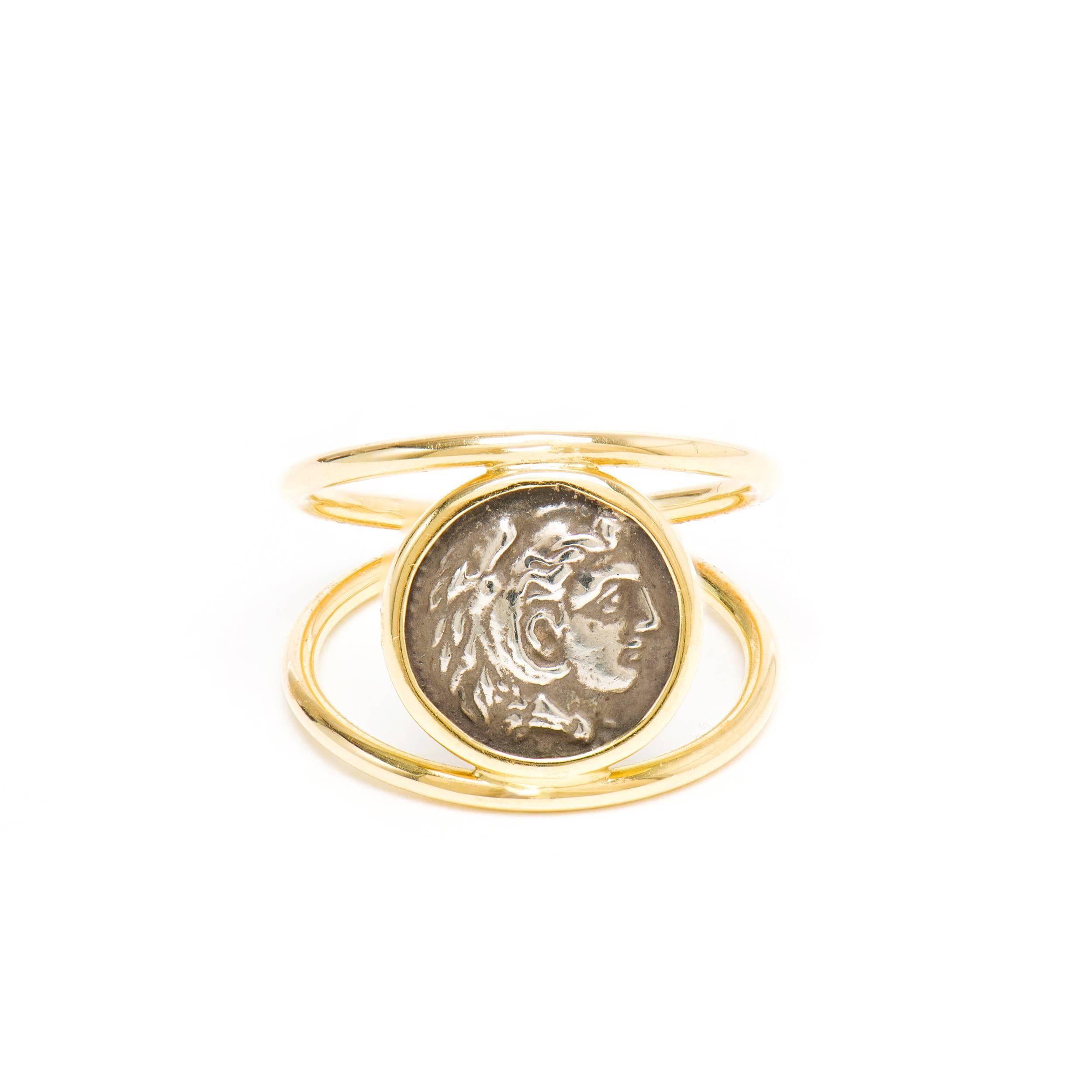 This DUBINI coin ring from the 'Empires' collection features an Alexander the Great silver coin set in 18K yellow gold.

HISTORY

Herakles was the greatest hero of the Greeks. Born of the Greek god Zeus and made mortal, he attained divine status by