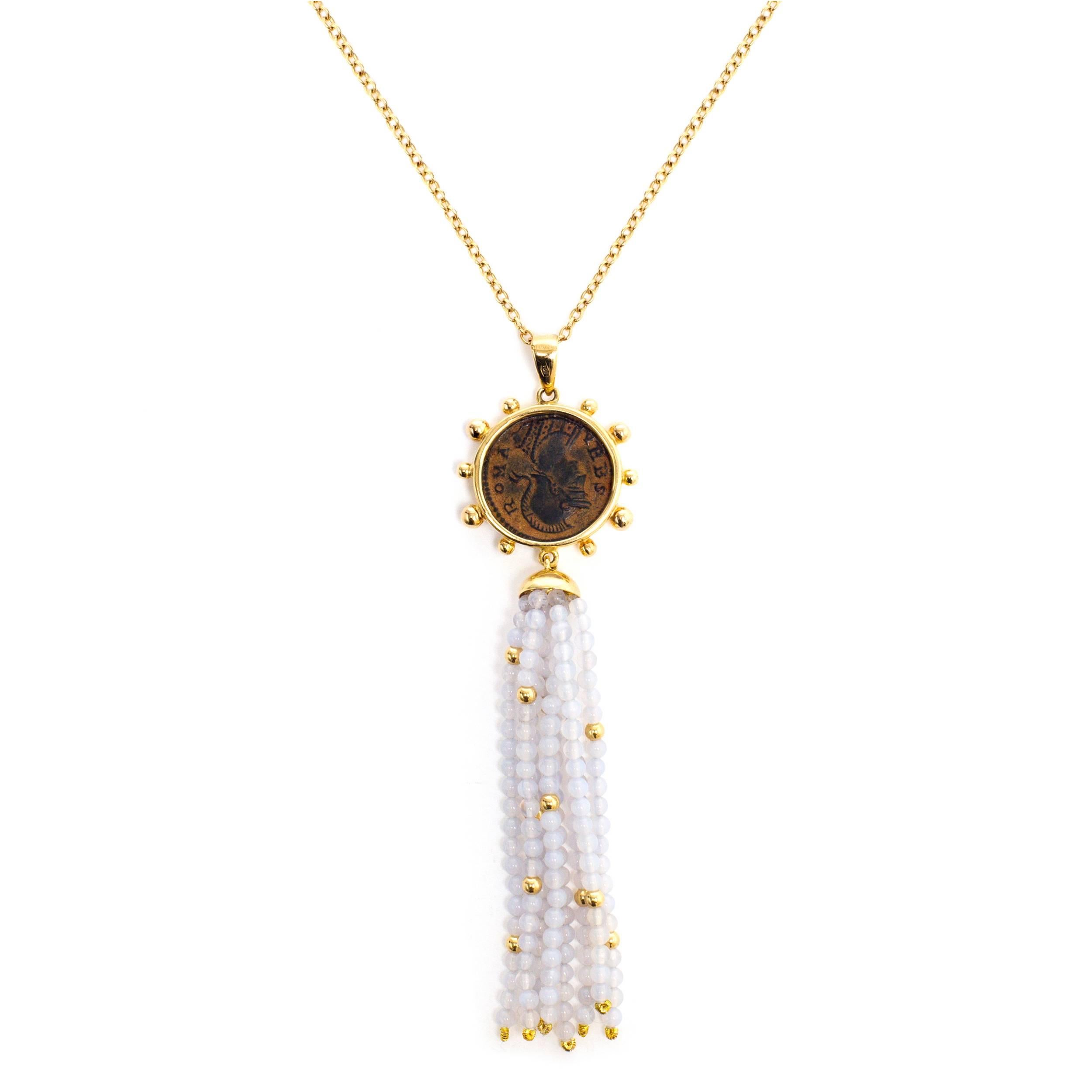 This DUBINI coin necklace from the 'Empires' collection features an authentic Roman Imperial coin minted circa 330-337 A.D. set in 18K yellow gold with chalcedony and gold beaded tassel..

Depicted on the coin: She-wolf suckling Romulus and Remus