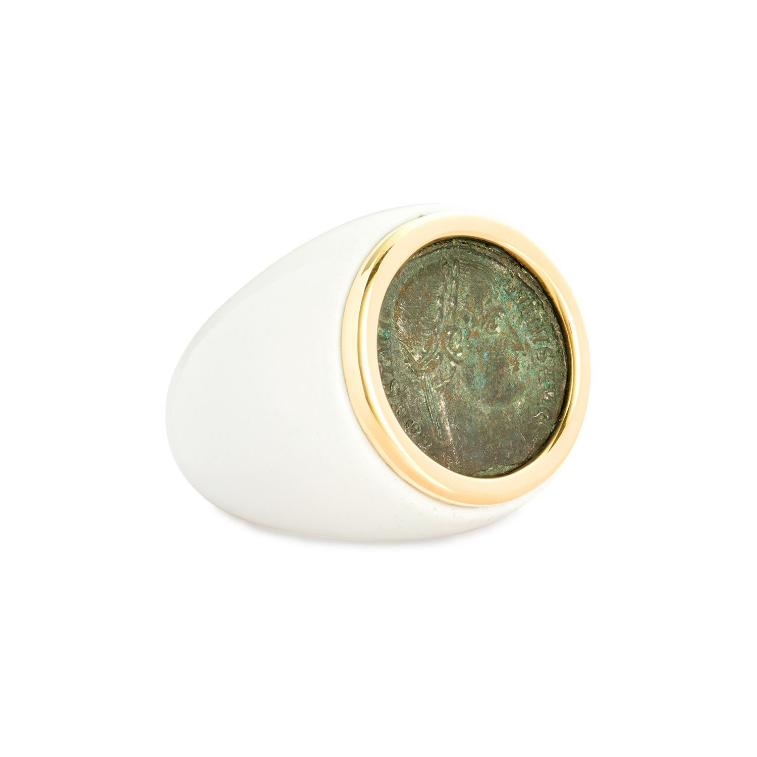 This DUBINI coin ring from the 'Empires' collection features a one-of-a-kind authentic Roman Imperial bronze coin set in 18K yellow gold and white agate base ring.

CARE

Each ancient coin and artefact featured in our jewellery has been meticulously