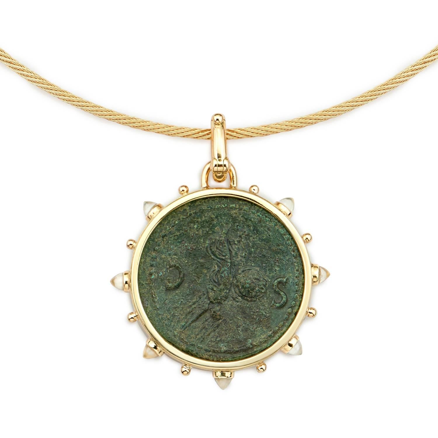 This DUBINI coin necklace from the 'Empires' collection features authentic bronze roman coin of Nero minted circa 54-68 A.D. set in 18K yellow gold with moonstone bullet cabochon on a twisted rope choker.

* Due to the unique process of hand carving