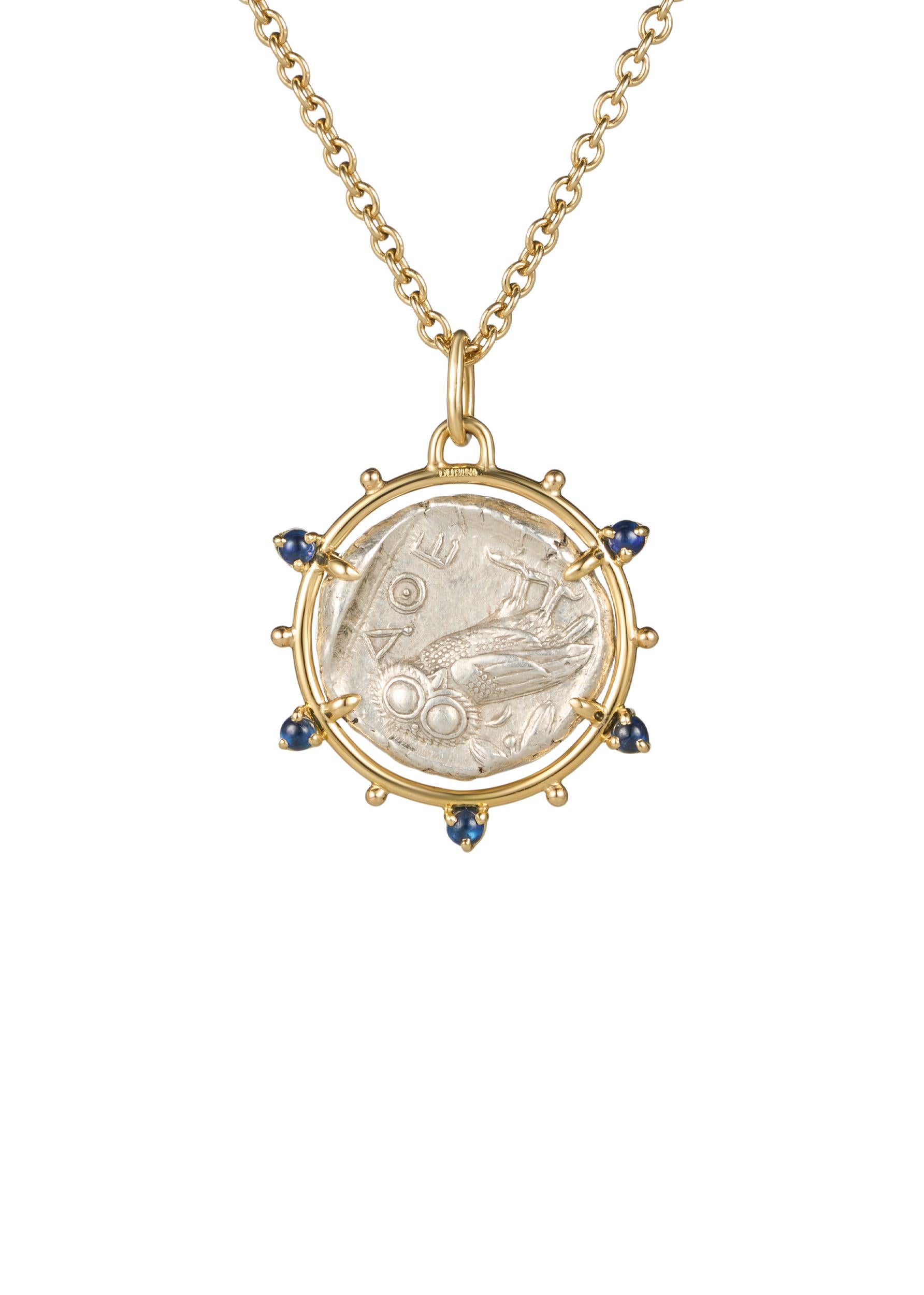 This exquisite necklace showcases an authentic AR tetradrachm coin of Athena, dating back to circa 454-404 B.C. set in 18K yellow gold, adorned with double-set emerald and sapphire cabochons.

COIN DETAILS:

Attica, Athens AR Tetradrachm. Circa