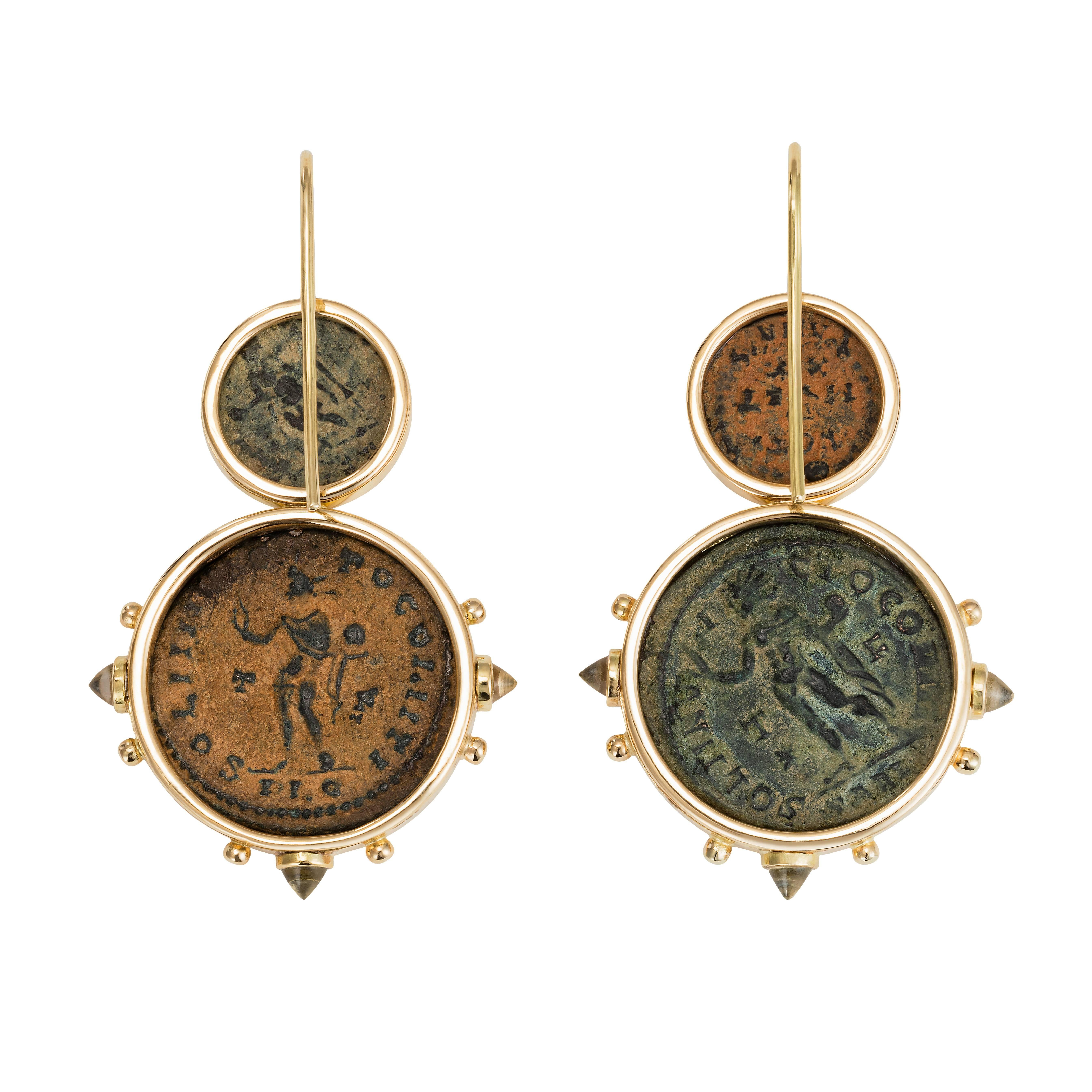 These Dubini coin earrings from the 'Empires' collection feature authentic Roman Imperial bronze coins with citrine bullet cabochons set in 18K yellow gold.


* Due to the unique process of hand carving coins in ancient times, there may be a few