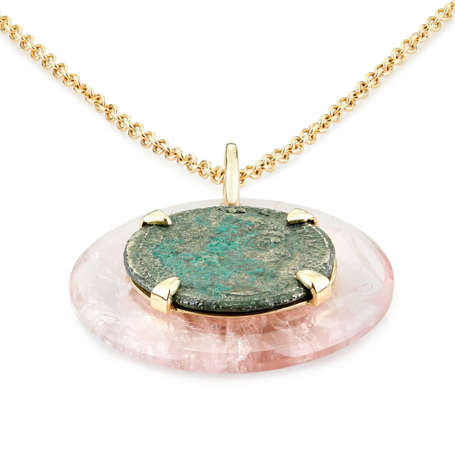 This DUBINI coin necklace from the 'Empires' collection features an authentic Roman bronze coin minted circa 307-337 A.D. set in 18K yellow gold with rose quartz disc.

Ancient Coin Ø 19mm
Disc Ø 30mm
Chain Length:  75cm included - also available