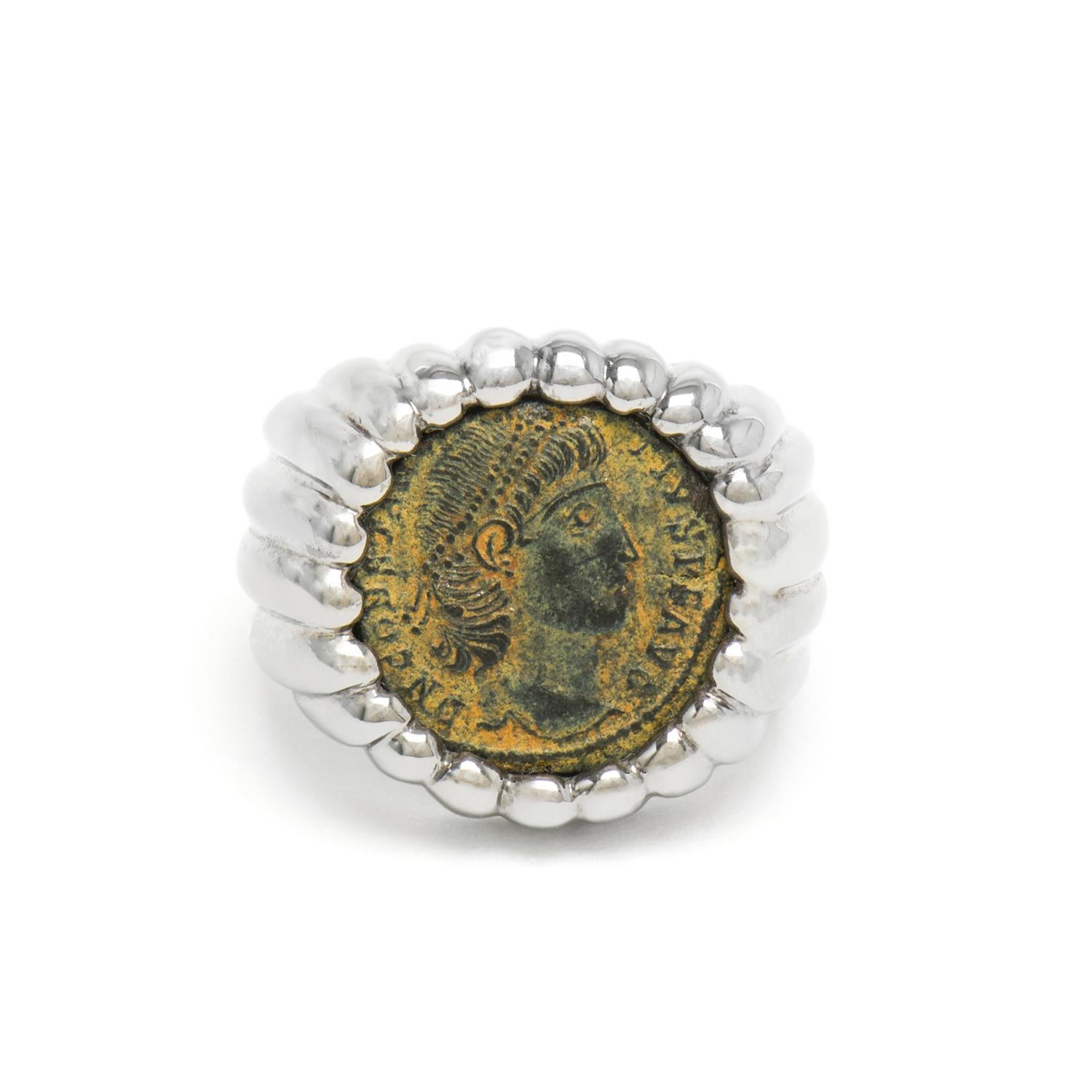 This DUBINI coin ring from the 'Empires' collection features an authentic Roman Imperial bronze coin depicting Constantine the Great set in black rhodium sterling silver.

The ring may be ordered in any size with a lead time of 3-4 weeks.

* Due to