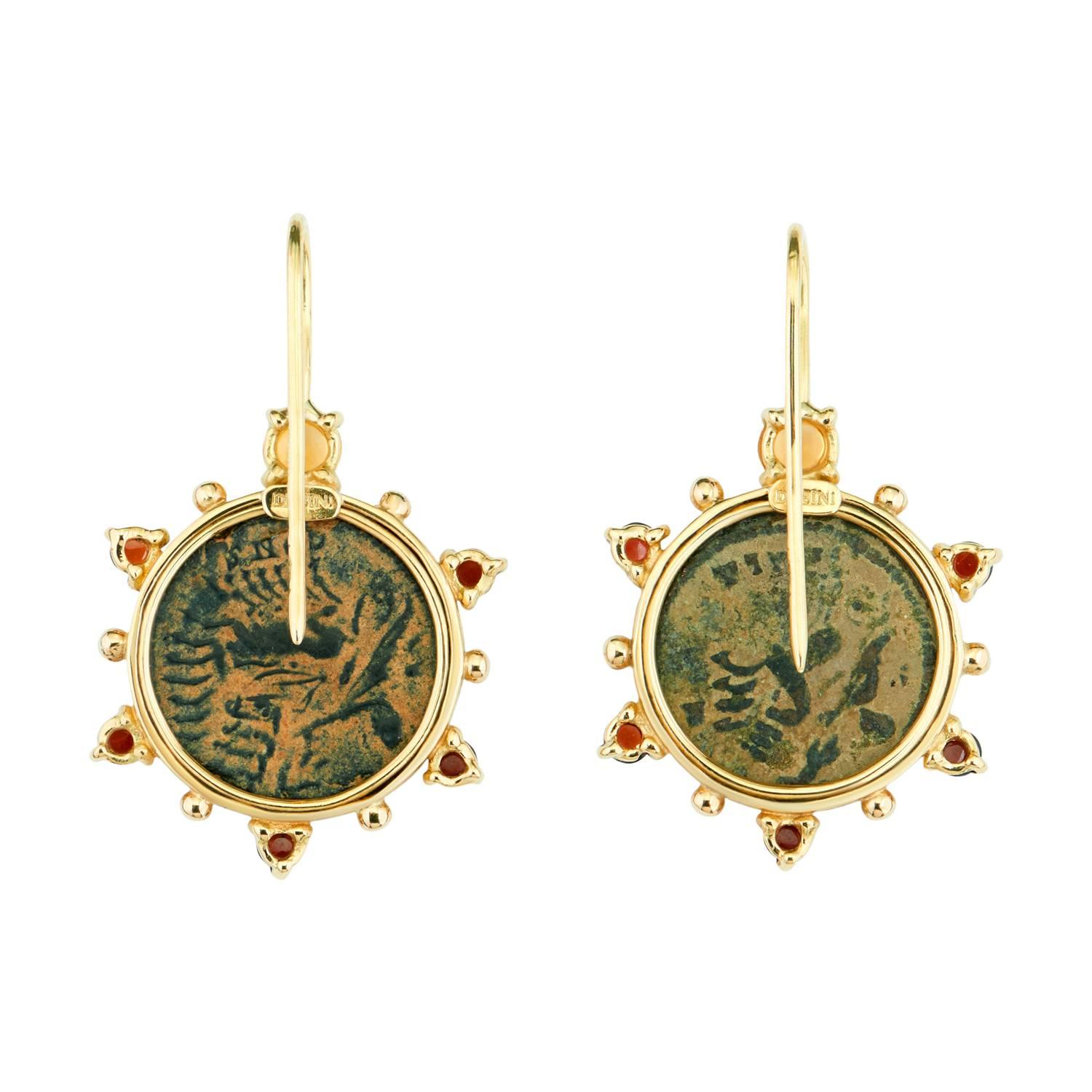 These Dubini coin earrings from the 'Empires' collection feature authentic Roman Imperial bronze coins set in 18K yellow gold with citrine and garnet cabochon stones.

* Due to the unique process of hand carving coins in ancient times, there may be
