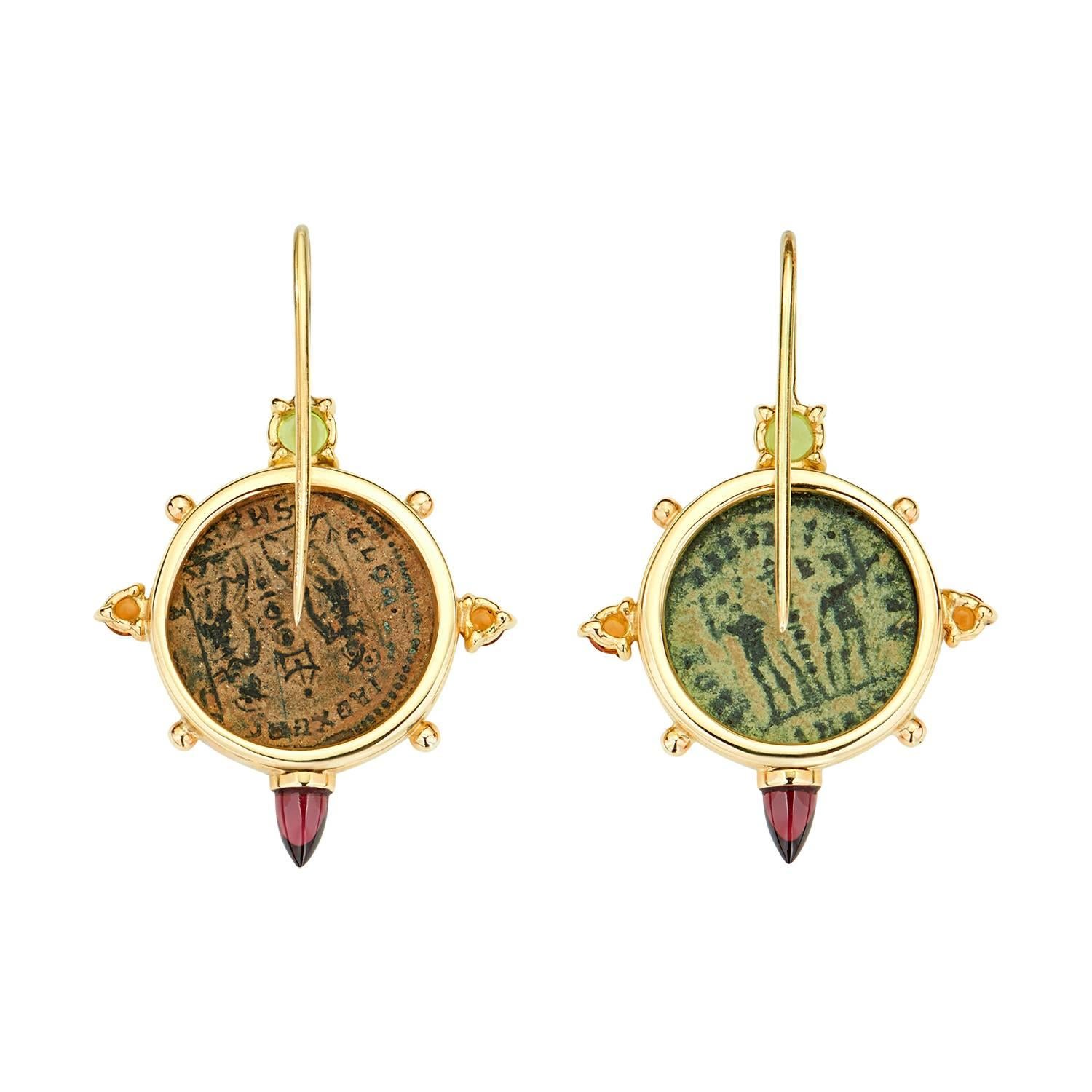 These Dubini coin earrings from the 'Empires' collection feature authentic Roman Imperial bronze coins set in 18K yellow gold with peridot, citrine and rhodolite.

* Due to the unique process of hand carving coins in ancient times, there may be a