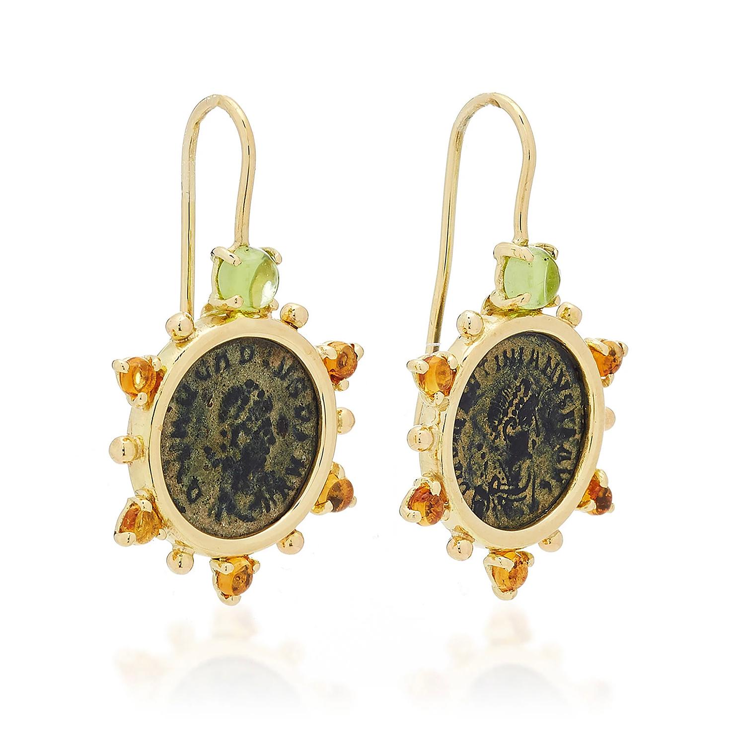 These Dubini coin earrings from the 'Empires' collection feature authentic Roman Imperial bronze coins set in 18K yellow gold with peridot and citrine cabochon stones.

* Due to the unique process of hand carving coins in ancient times, there may be