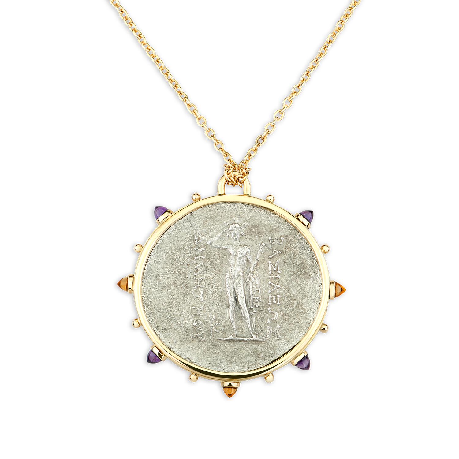 This DUBINI coin necklace from the 'Empires' collection features an authentic silver coin of Demetrios I minted circa 200-185 B.C. set in 18K yellow gold with bullet amethyst and citrine cabochons.

Depicted on the coin: Demetrios I, wearing