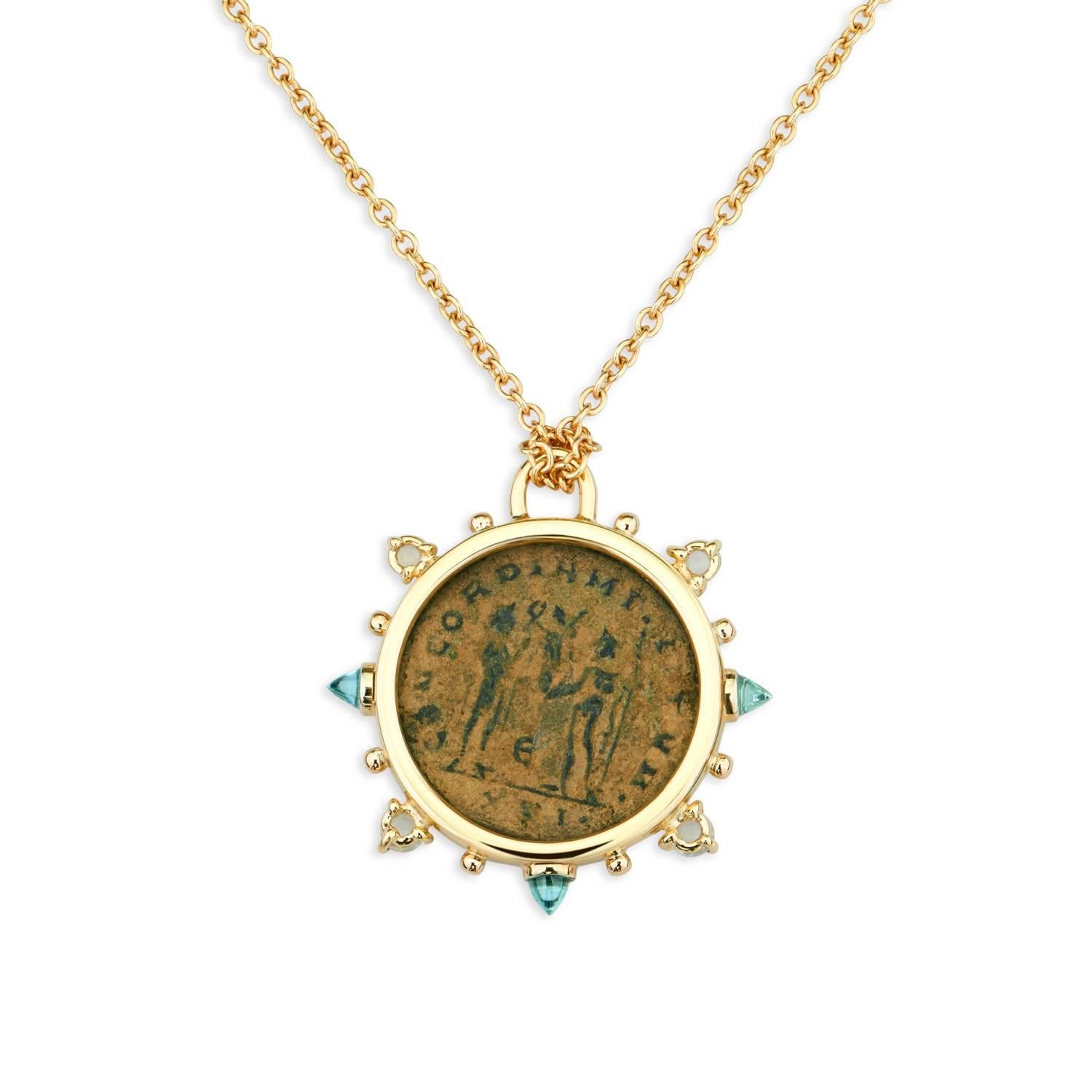 This DUBINI coin necklace from the 'Empires' collection features an authentic Roman bronze coin minted circa 295-299 A.D. set in 18K yellow gold with bullet blue topaz and moonstone cabochons.

Depicted on the coin: Diocletian, on the obverse and