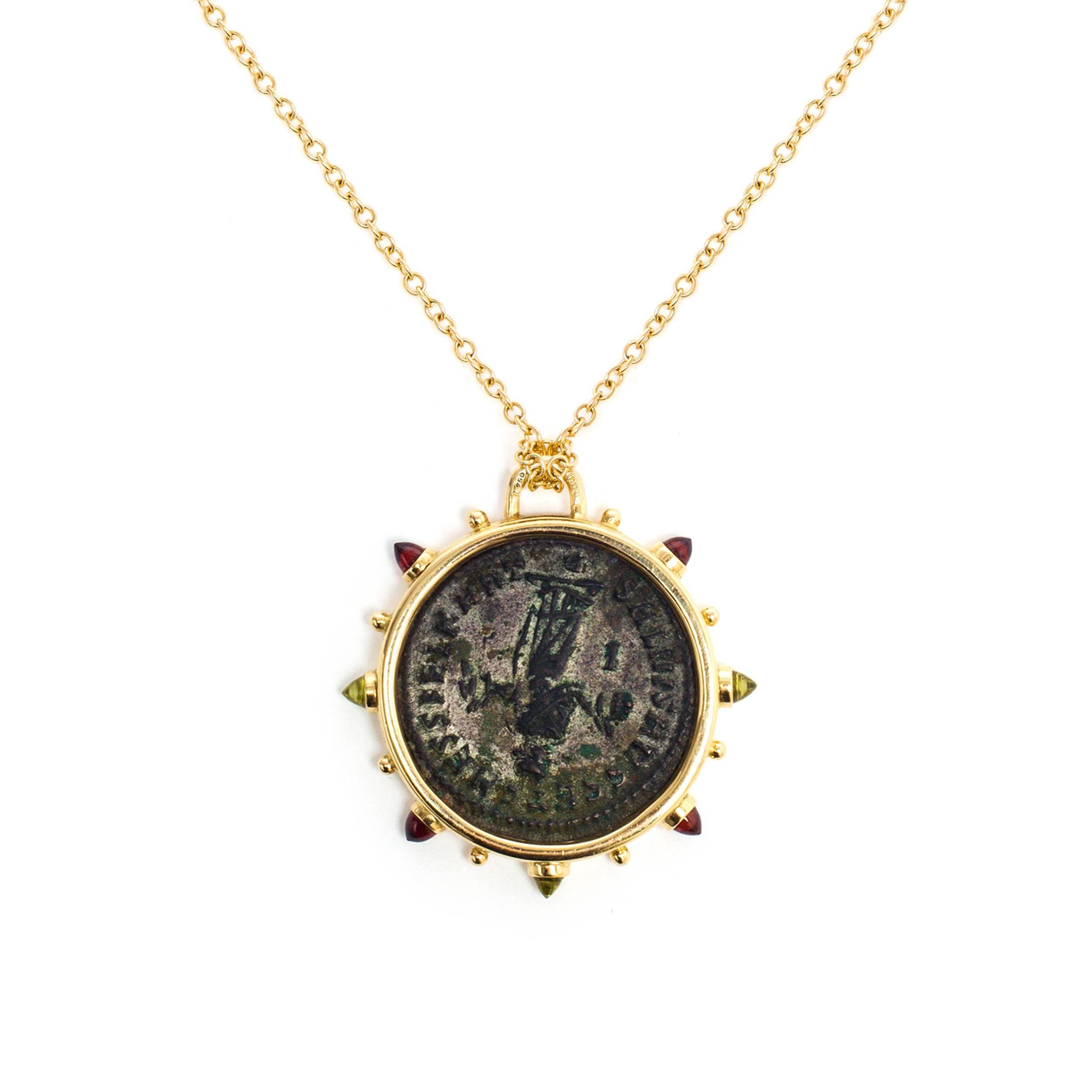 This DUBINI coin necklace from the 'Empires' collection features an authentic coin set in 18K yellow gold with garnet and peridot cabochons. 

Rolo Chain length 75cm is included.
Also available 47cm or 60cm upon request.

* Due to the unique process