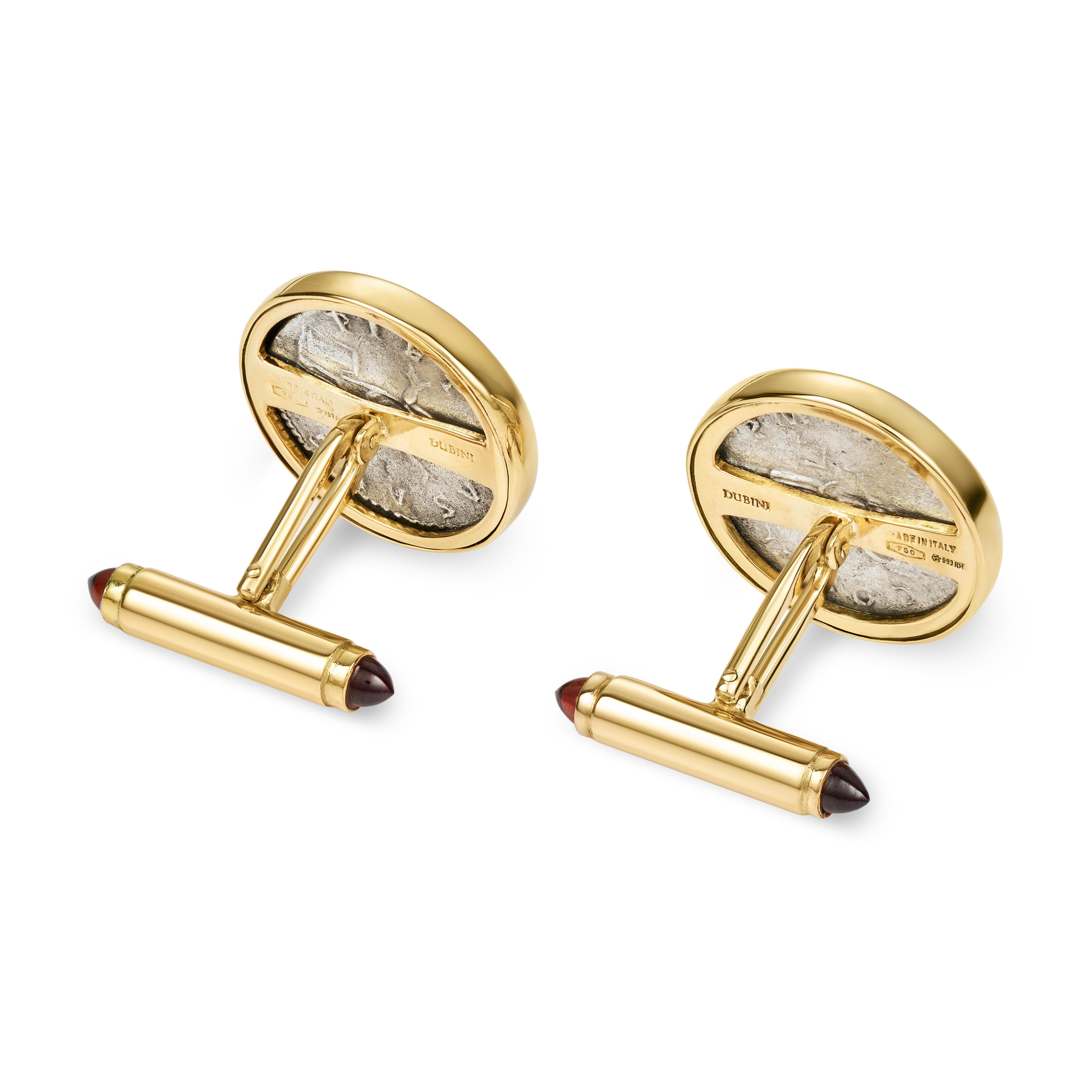 These DUBINI coin cufflinks from the 'Empires' collection feature authentic Roman Imperial coins minted circa A.D. 133-135 set in 18K yellow gold with garnet cabochons.

HISTORY

Hadrian (l. A.D. 78-138) was emperor of Rome (r. A.D. 117-138) and is