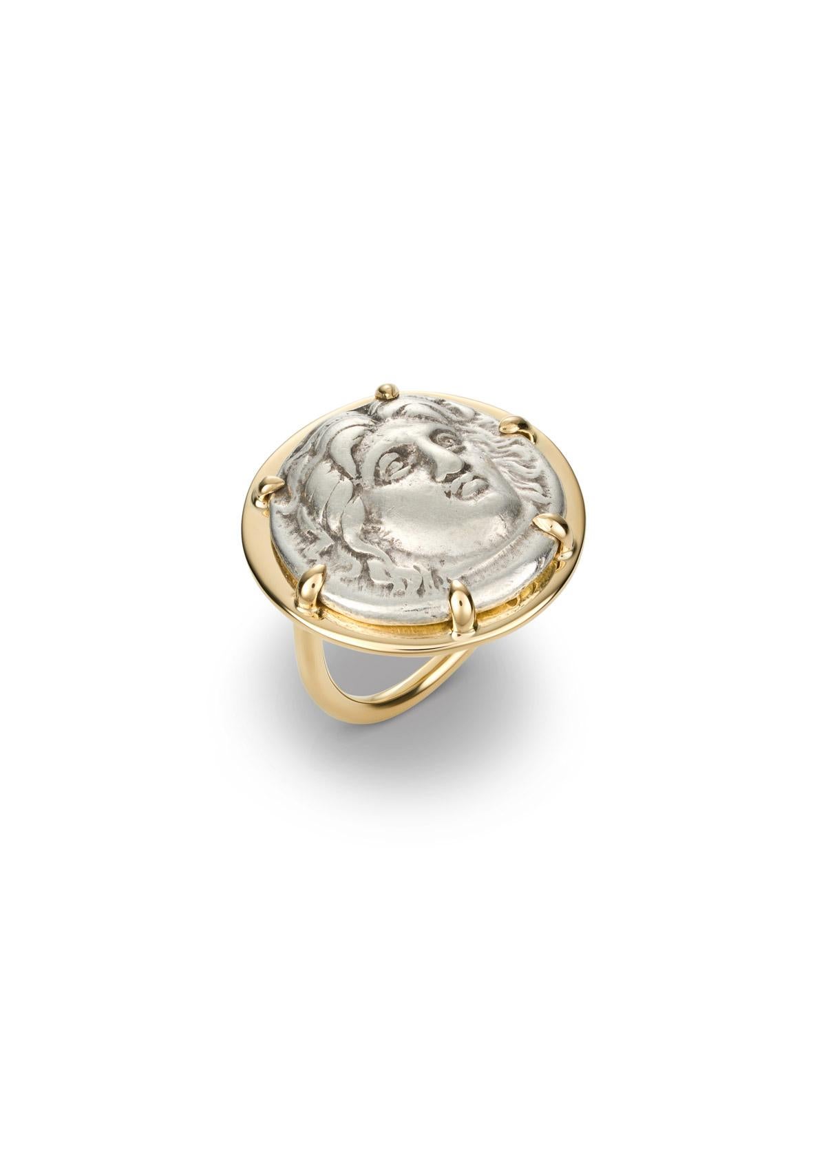 This DUBINI coin ring from the 'Empires' collection features an authentic silver coin from Rhodos dating circa 307-304 B.C. set in 18K yellow gold.

Coin Ø 19mm

DEPICTED ON COIN: 
Obverse - Radiate head of Helios.
Reverse - Rose with bud to