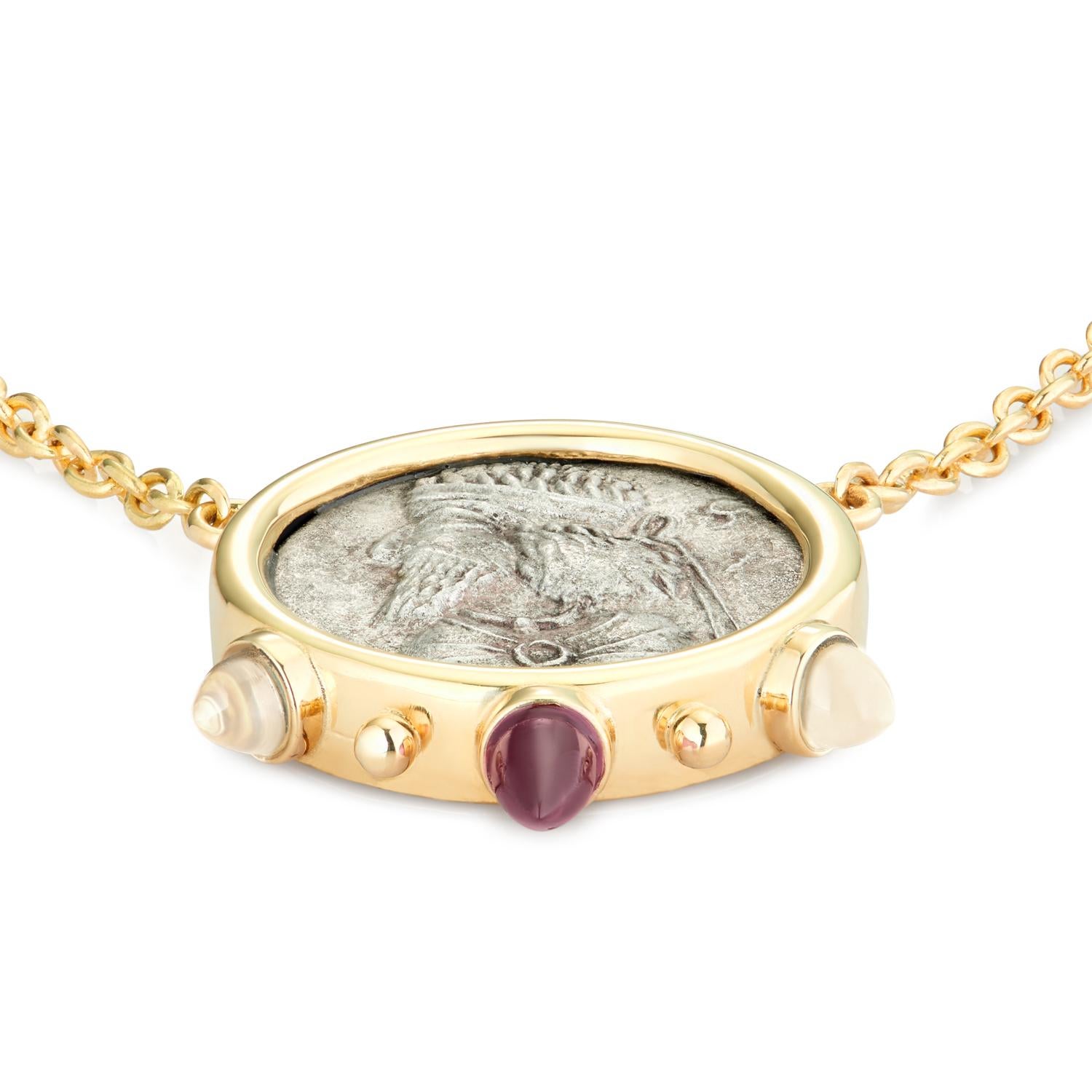 This DUBINI coin necklace from the 'Empires' collection features an authentic Persian coin minted circa 1-2 century A.D. set in 18K yellow gold with rhodolite garnet and moonstone bullet cabochons.

* Upon request each piece is provided with a
